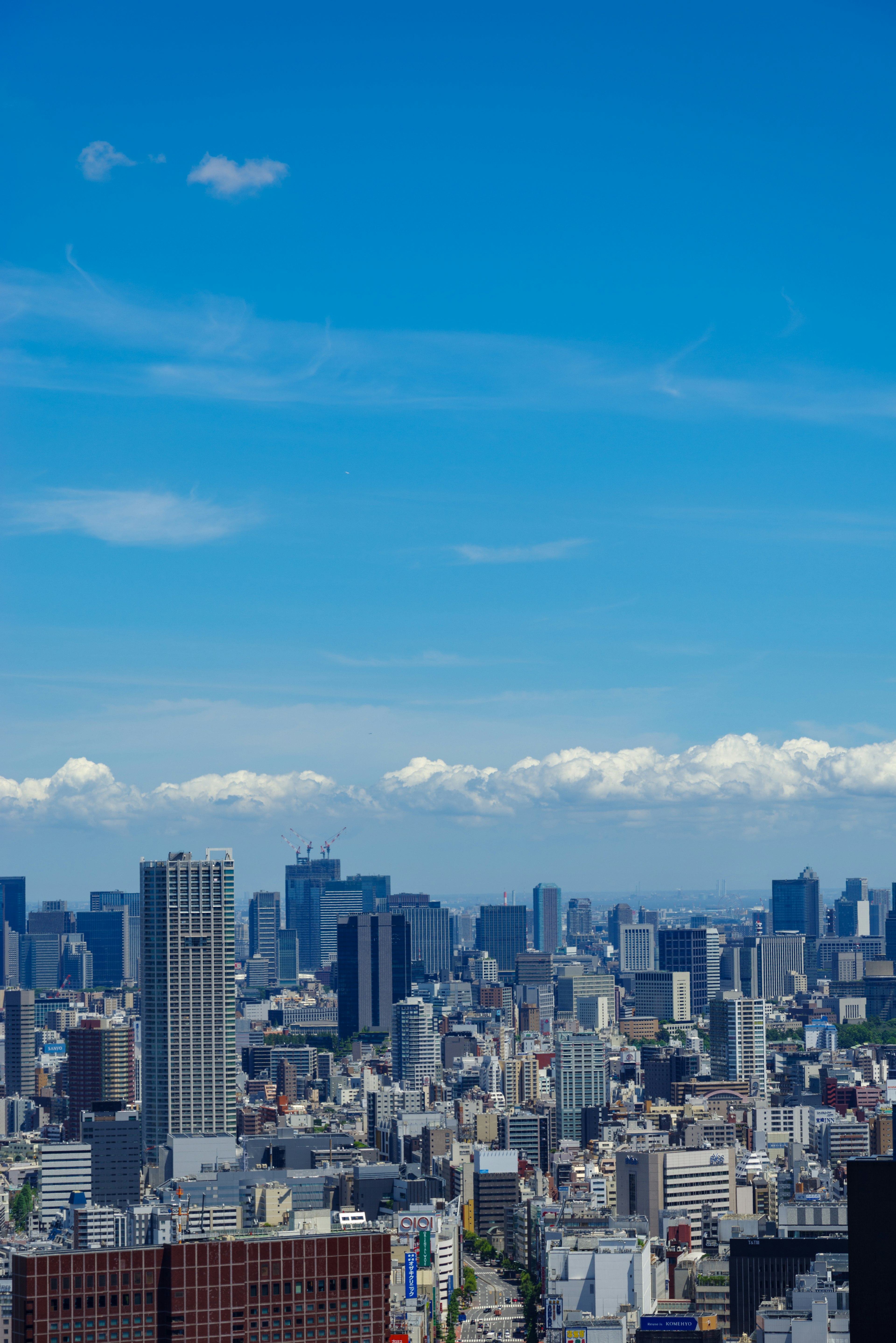 City skyline featuring tall buildings under a clear blue sky