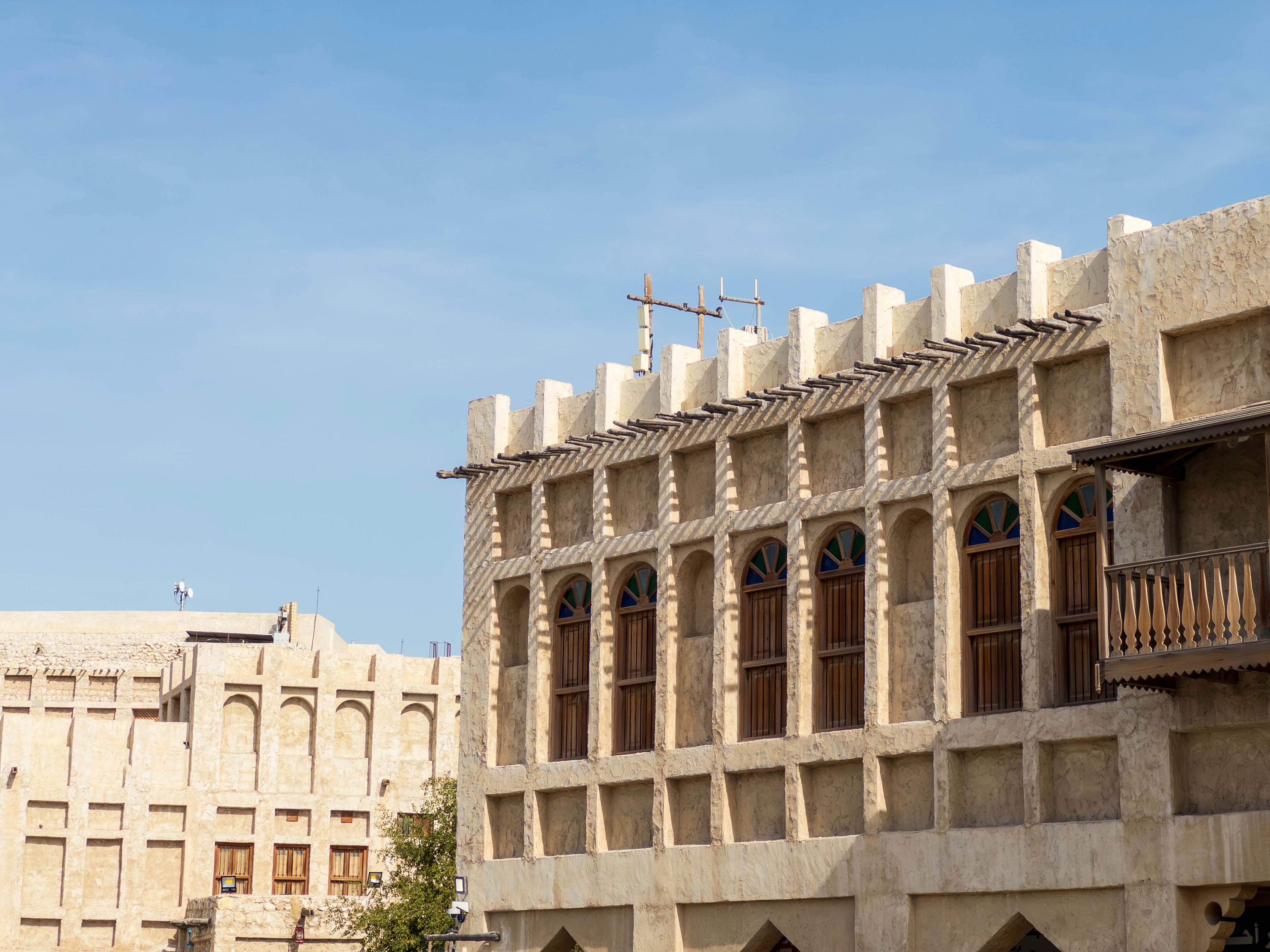 Traditional Arabian architecture under a blue sky