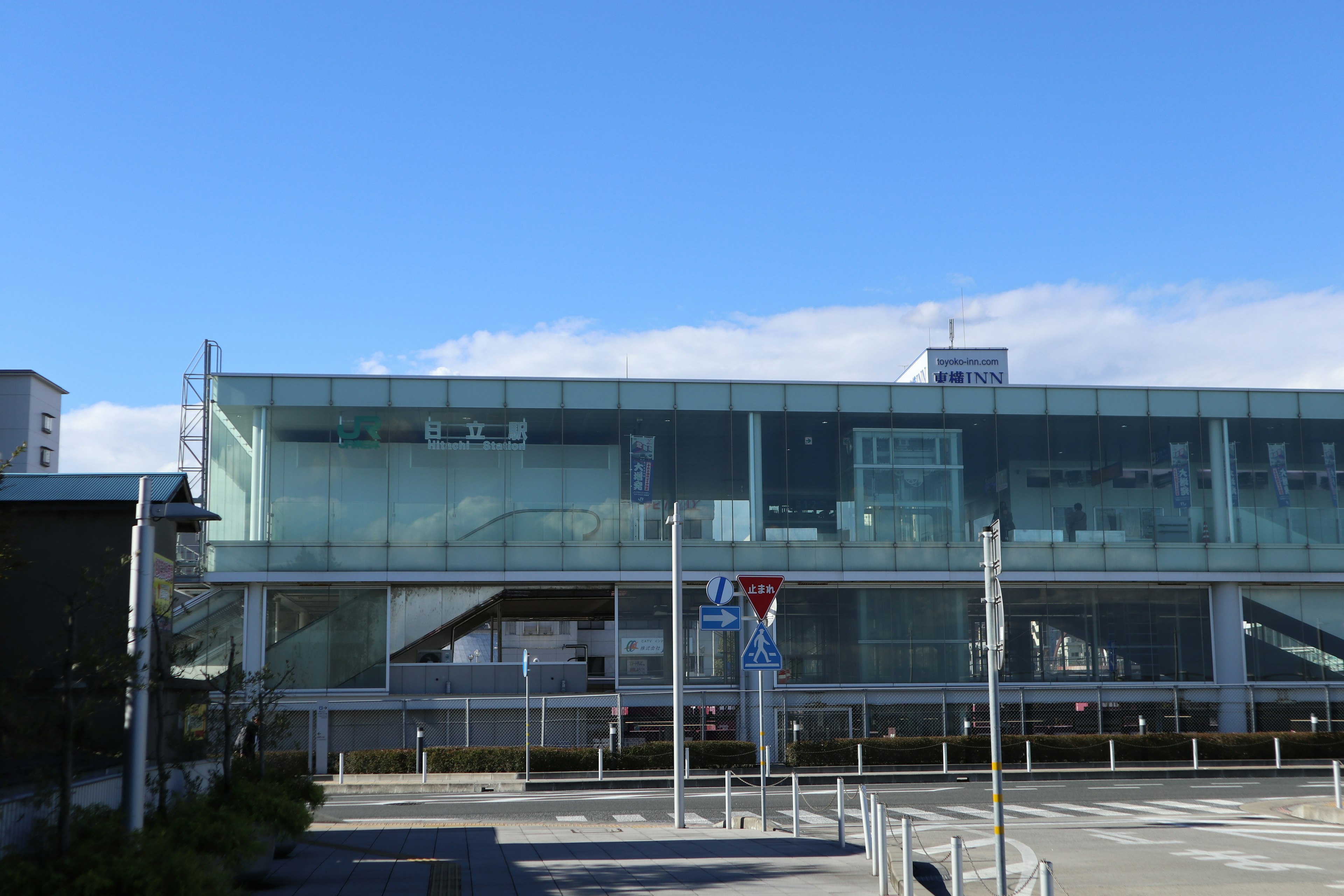 Modern glass train station with blue sky