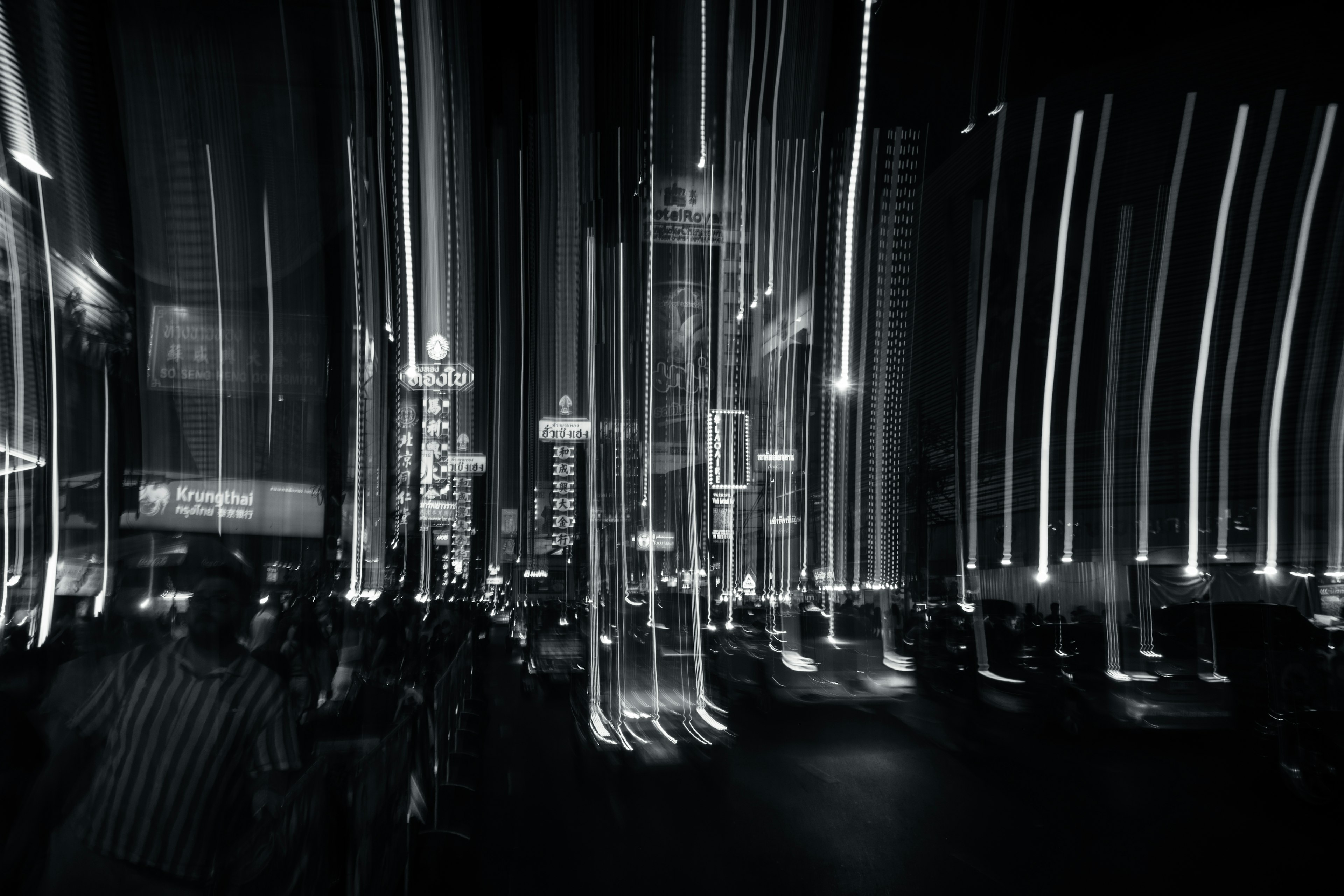 Black and white city nightscape with elongated light streaks