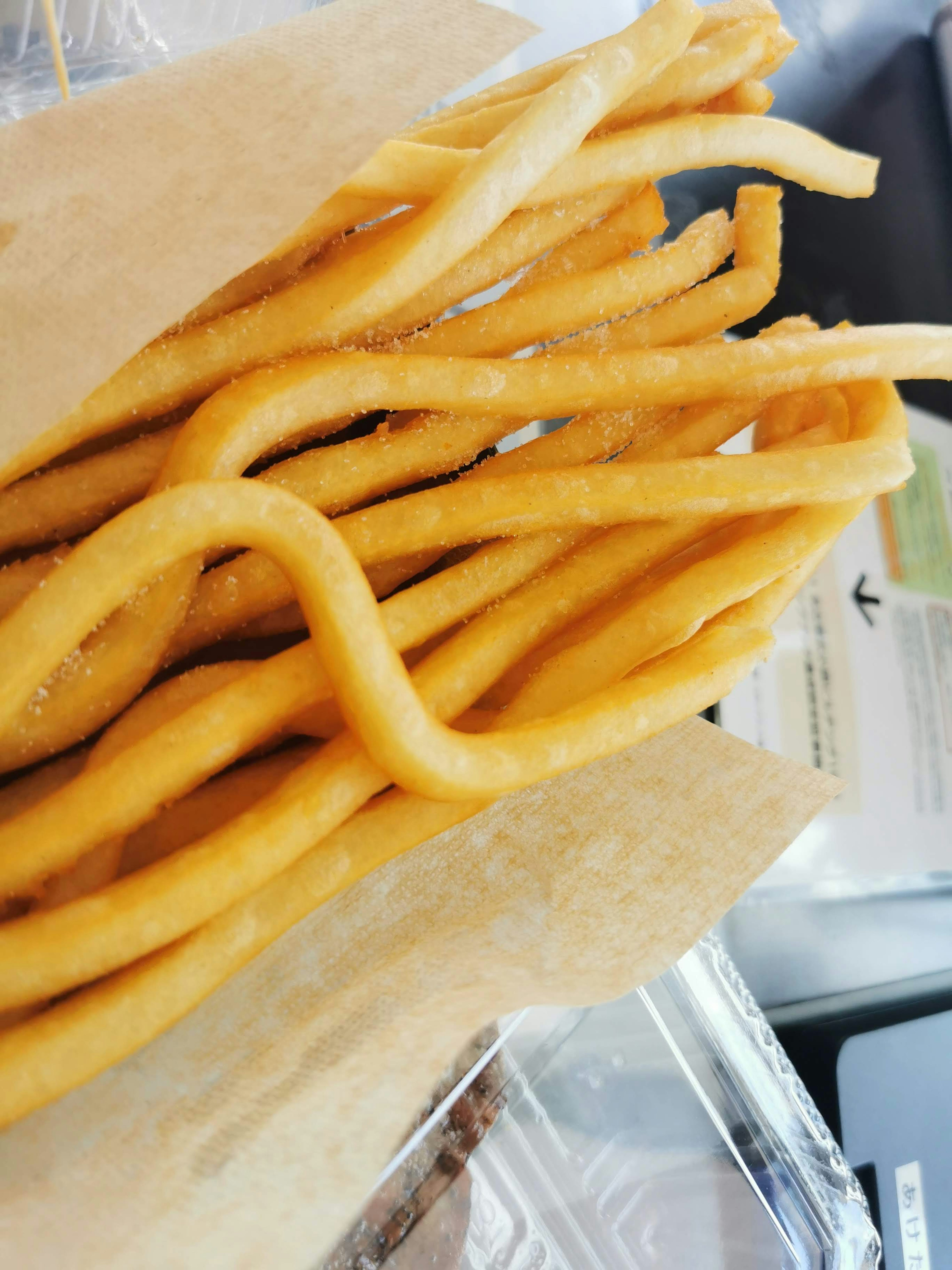 Crispy fried sticks arranged on a wooden tray