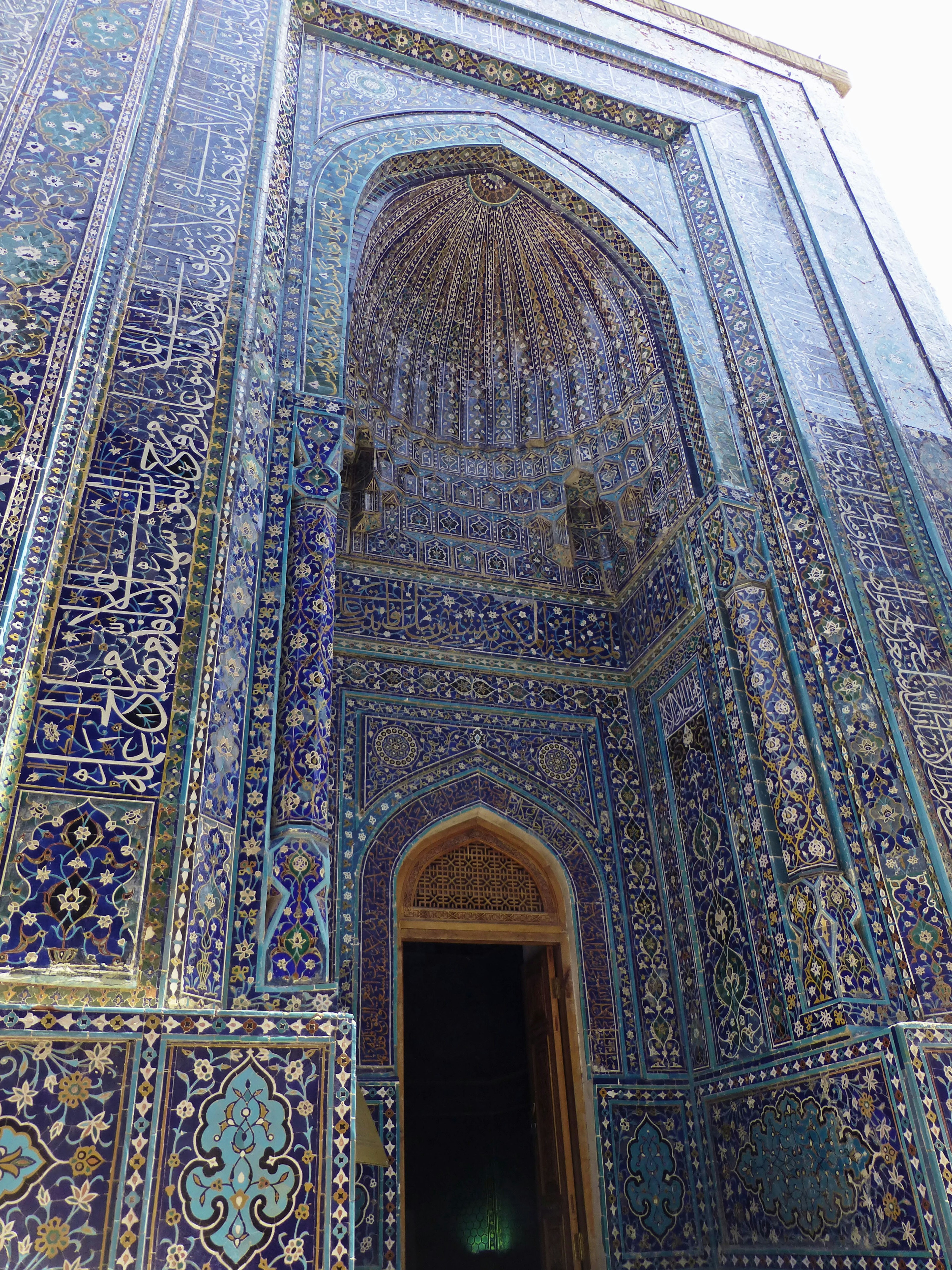 Intricate mosaic tile entrance of a historical building