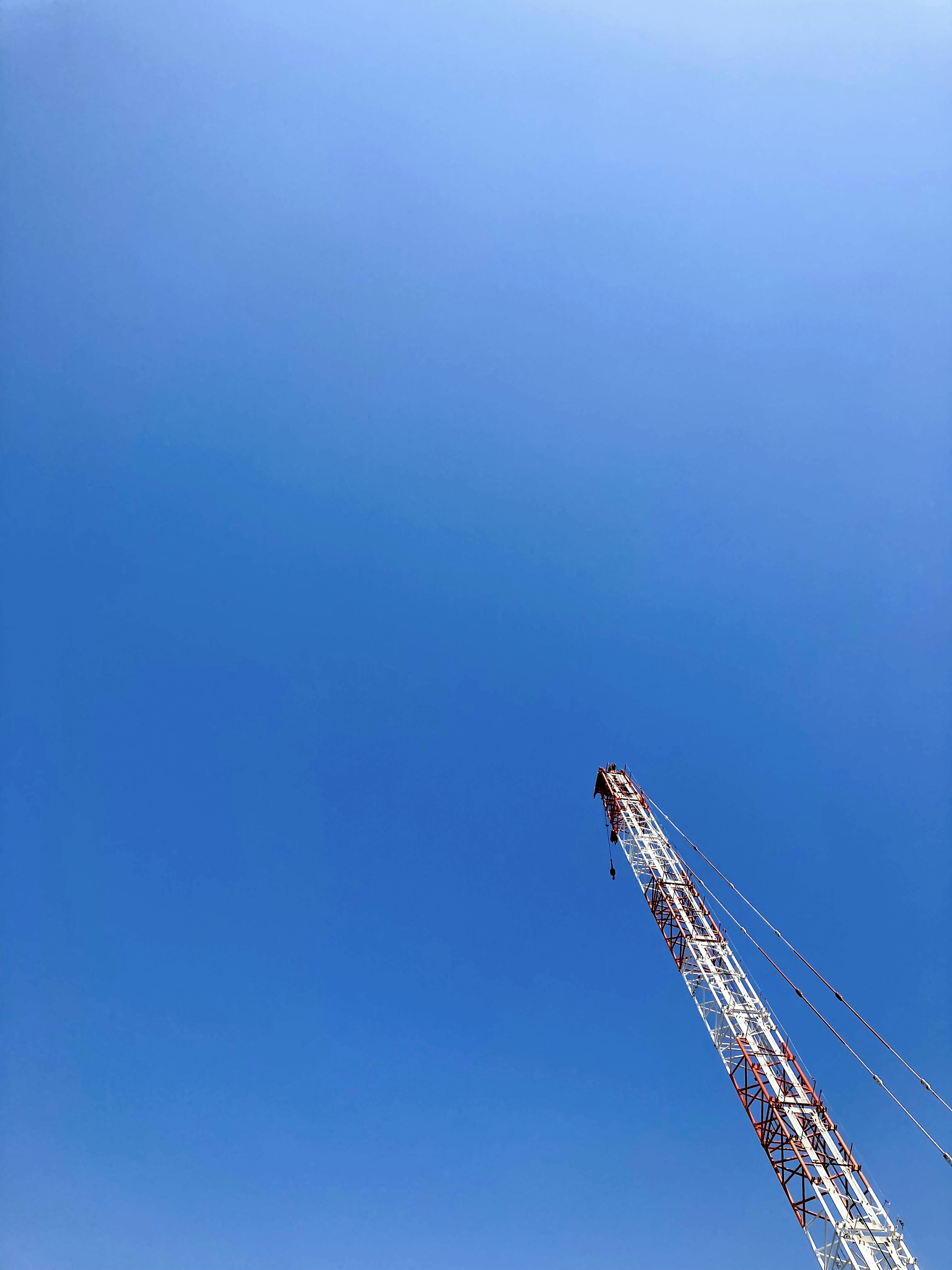 Crane towering against a clear blue sky