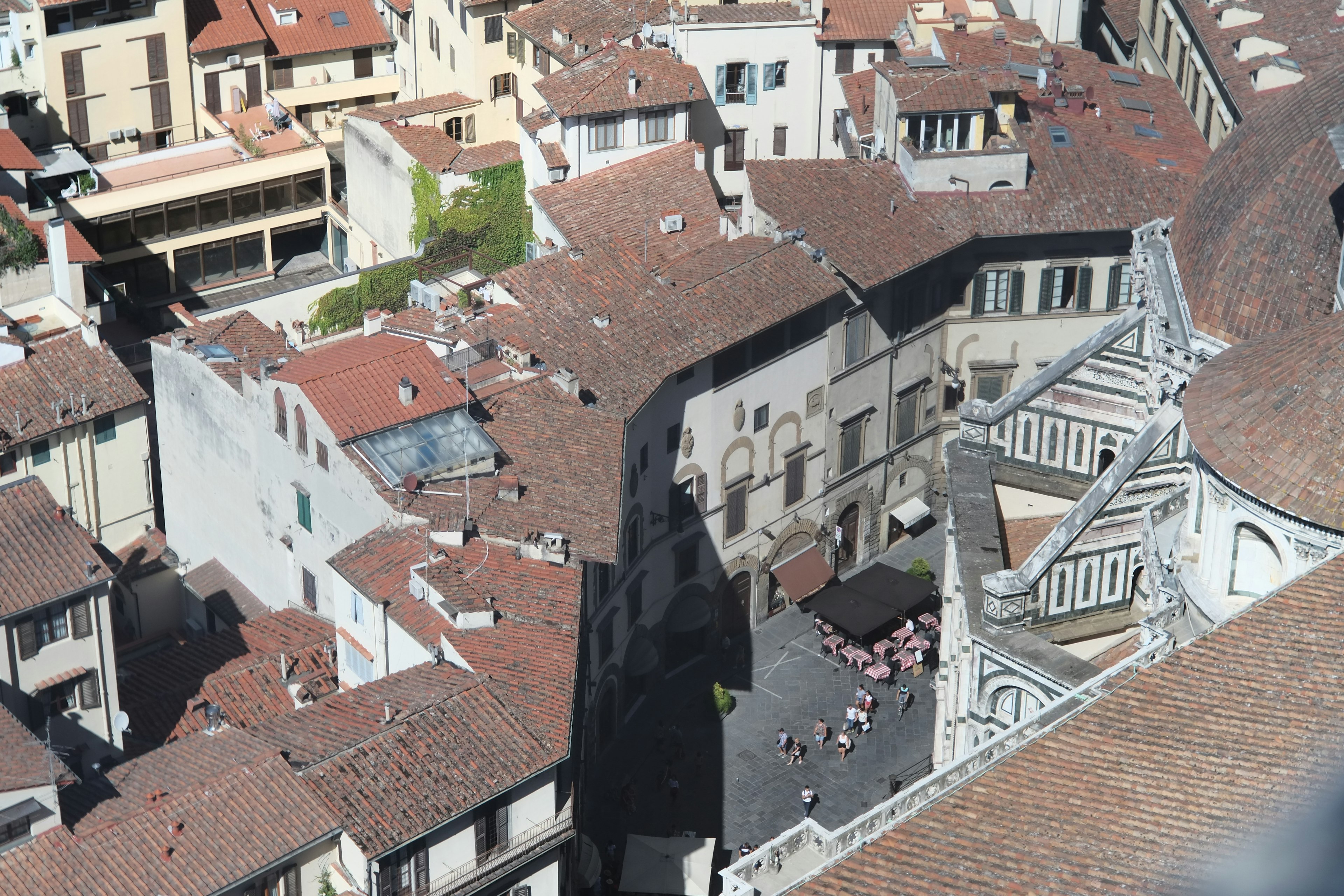 Aerial view of historic buildings and red rooftops in Florence