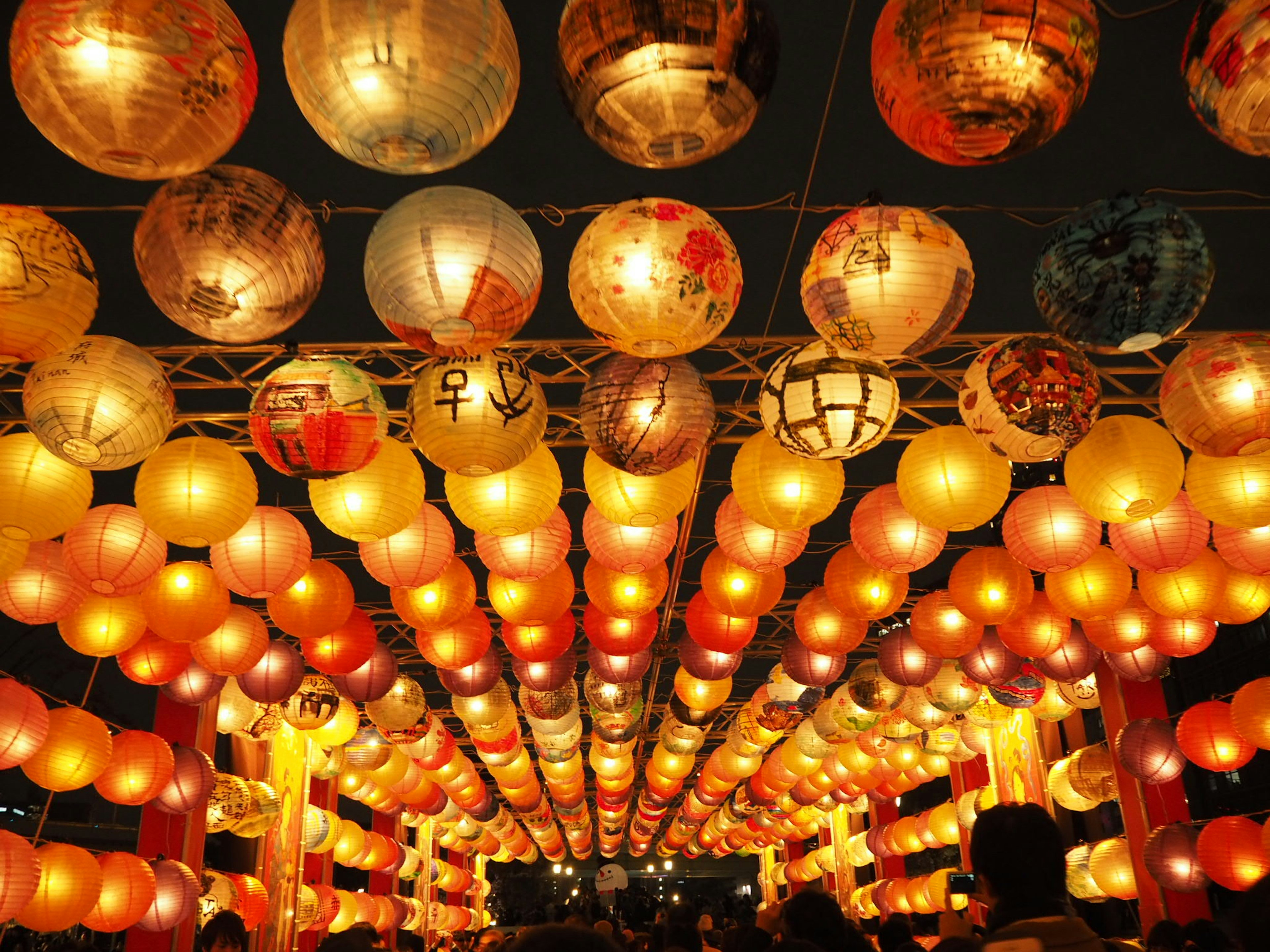 Colorful lanterns hanging in a night festival scene