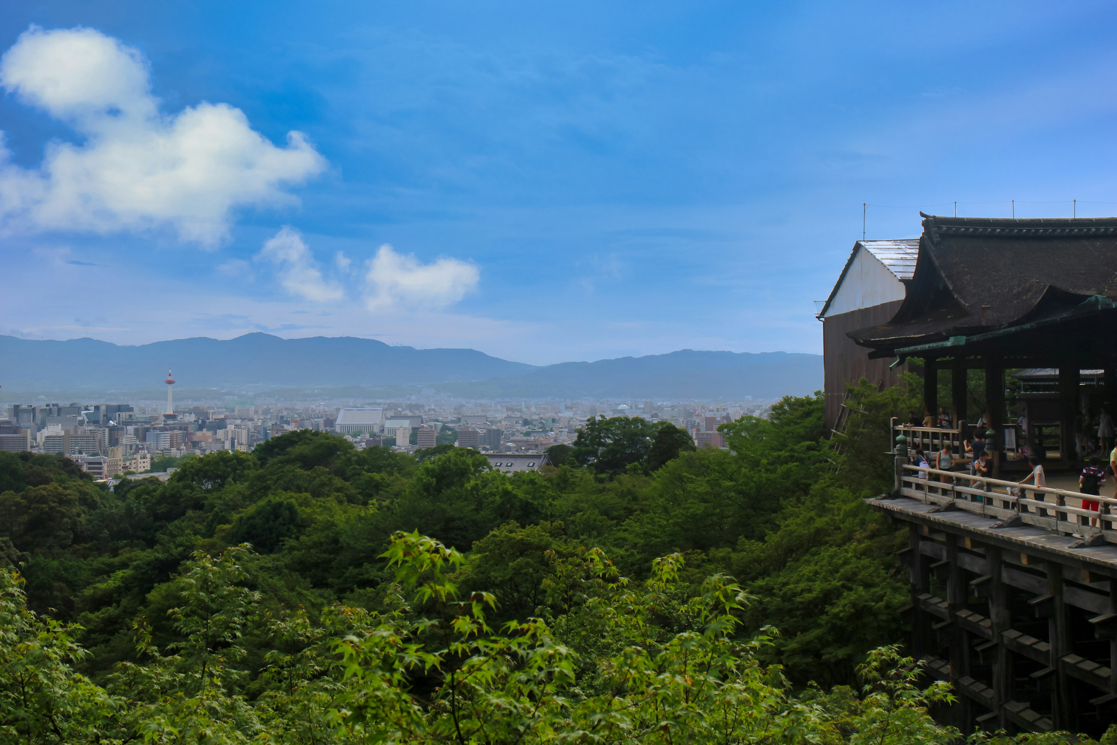 Building with a view of lush greenery and distant mountains