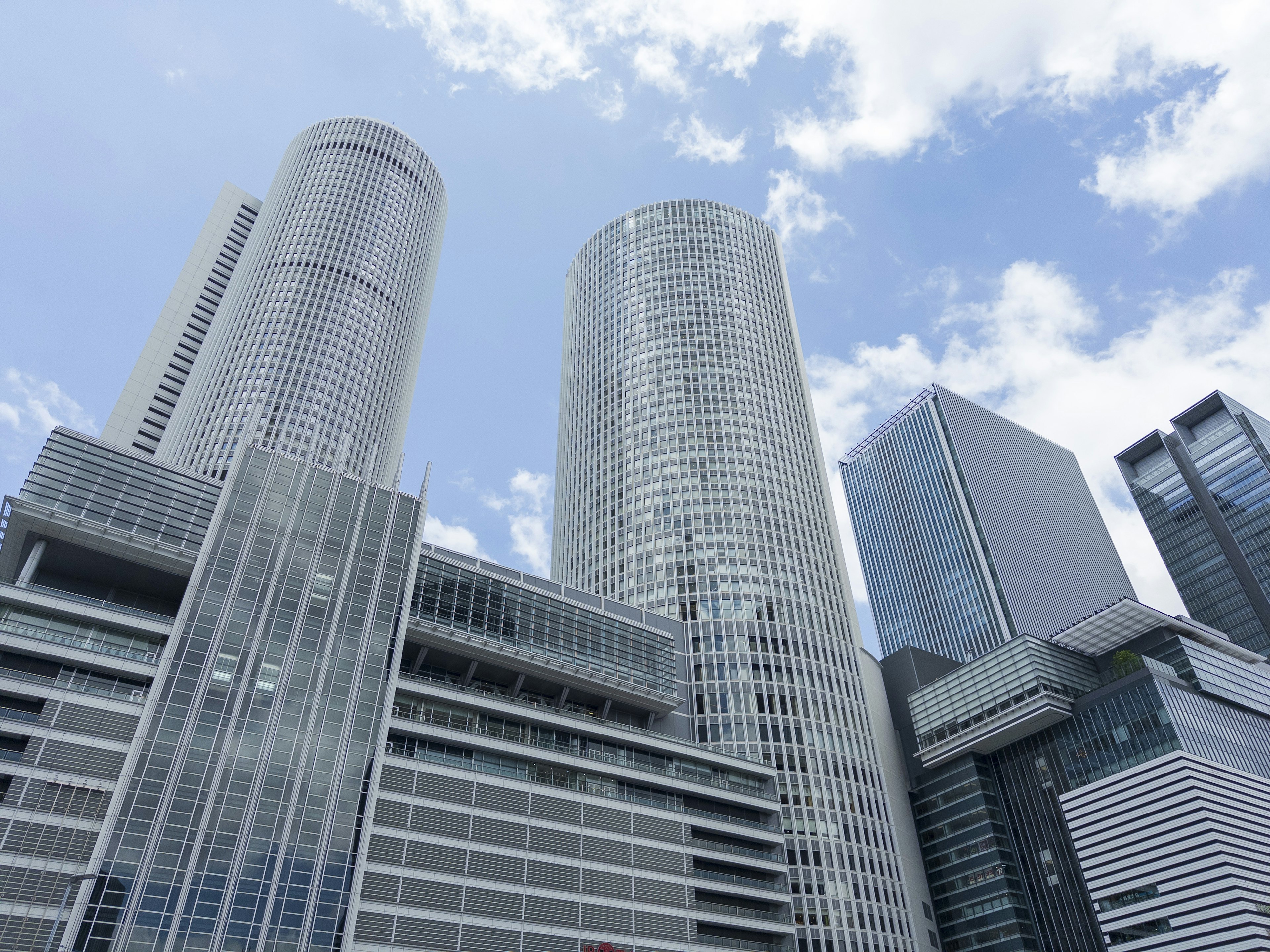 Close-up view of skyscrapers against a blue sky