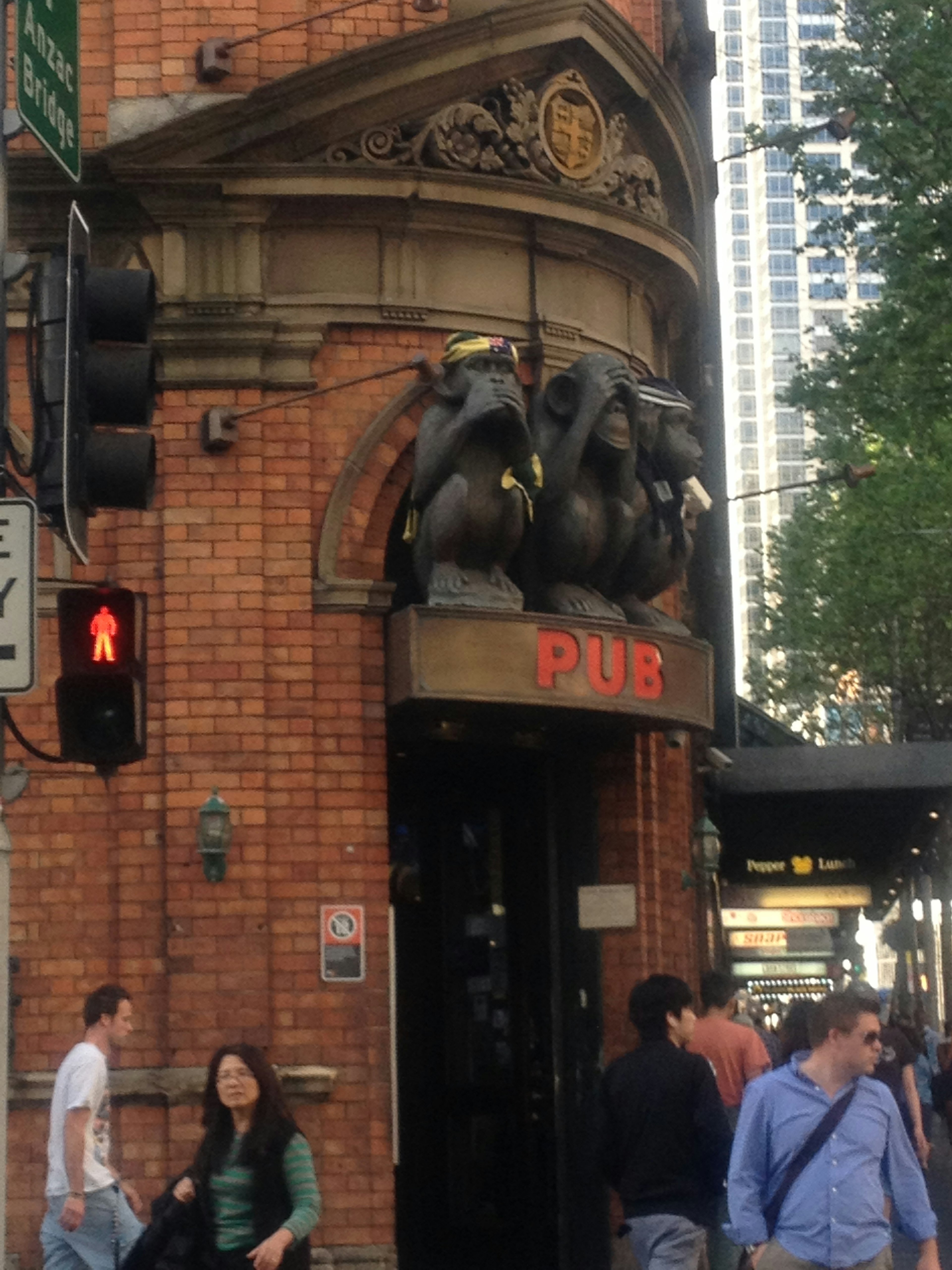 Unique pub entrance with brick architecture and sculptures