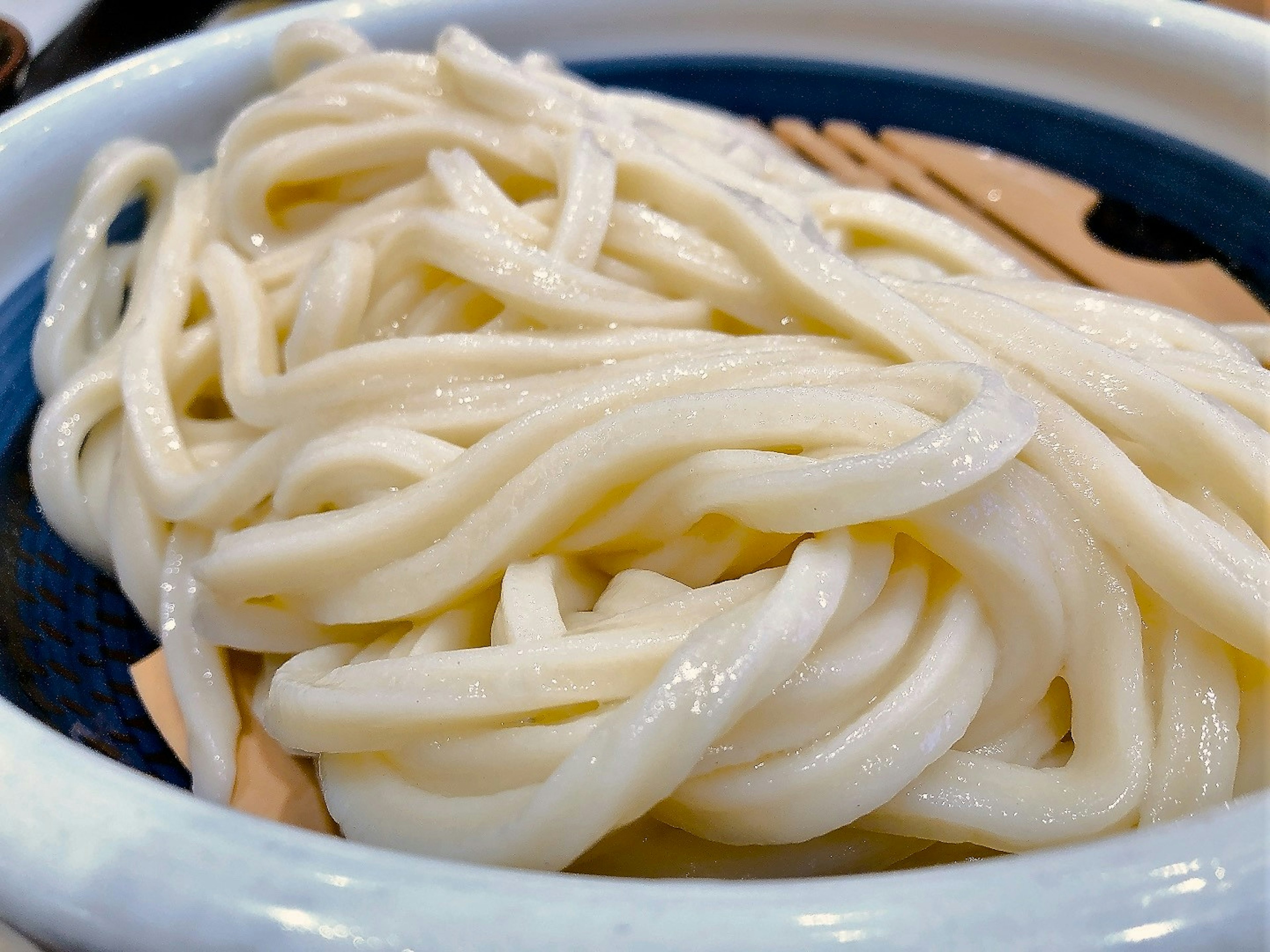 Close-up of white udon noodles served in a bowl