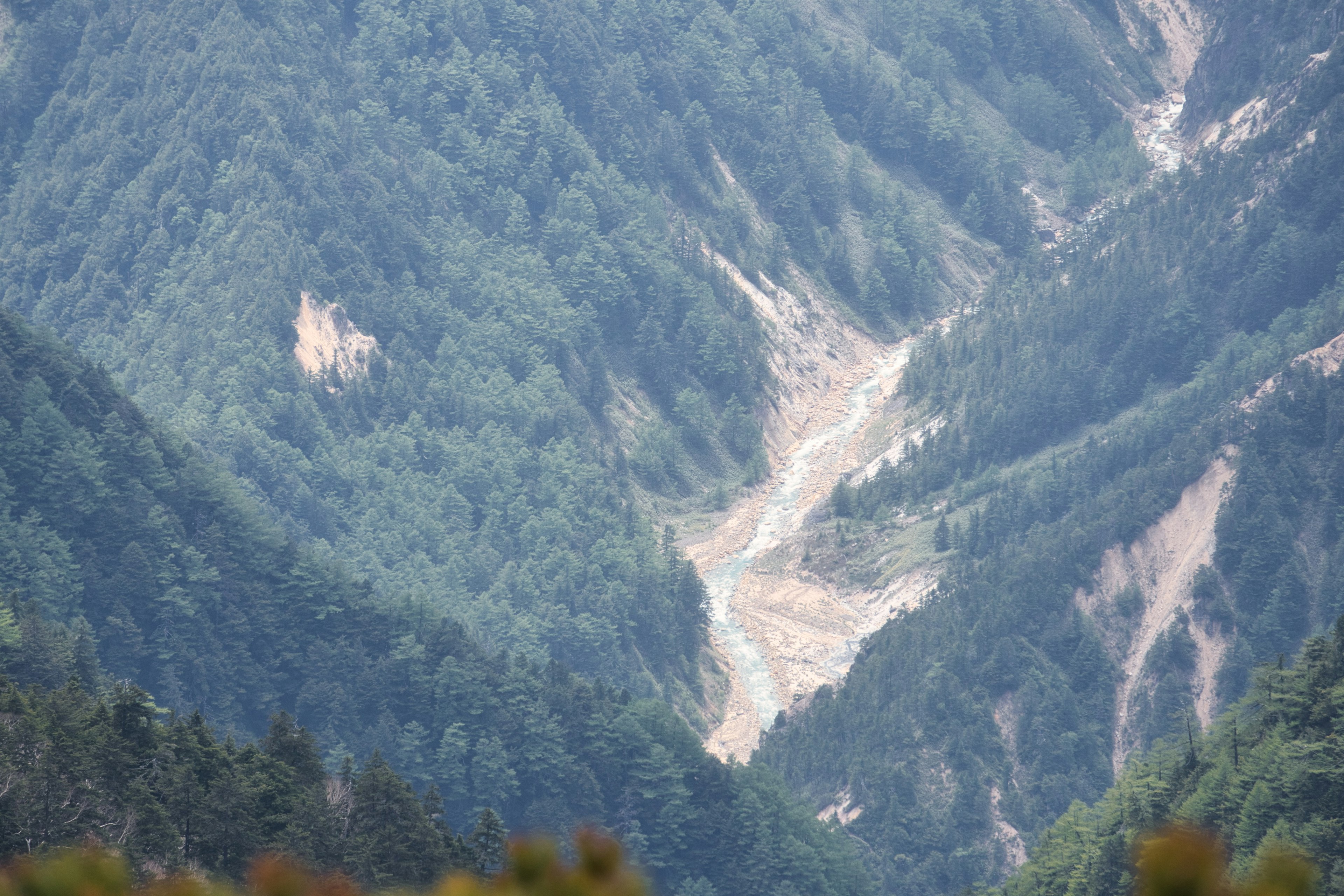 A scenic view of green mountains and valleys