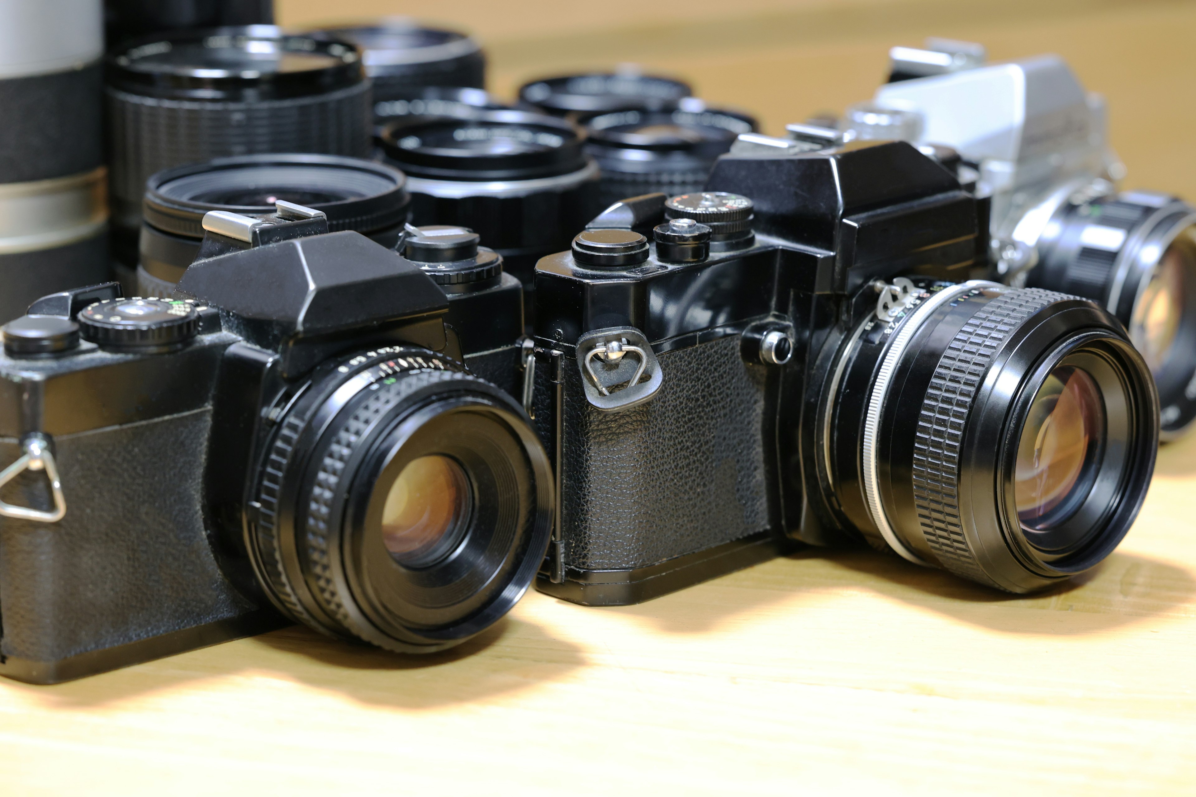 A collection of vintage cameras with prominent lenses