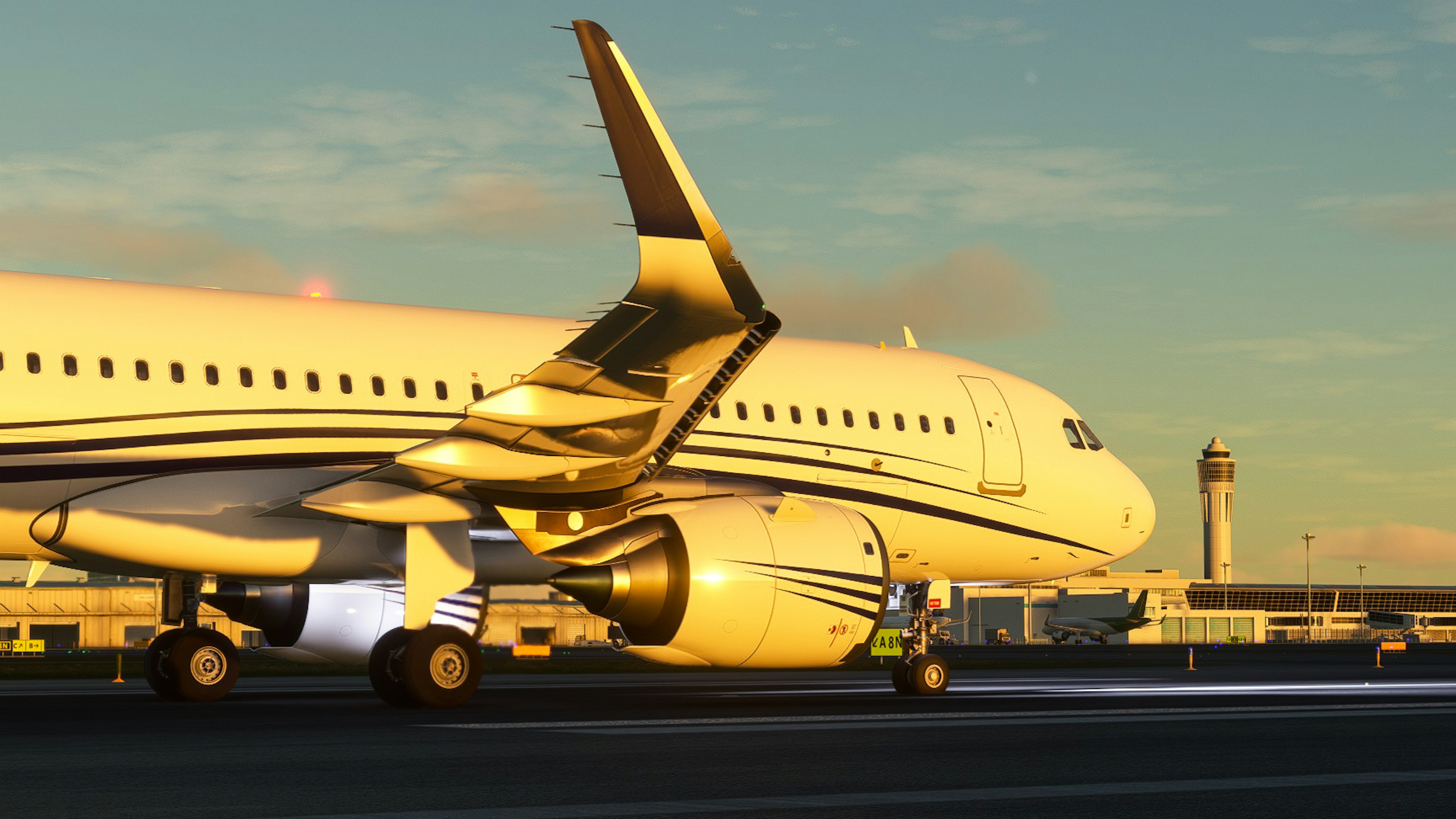 Business jet aircraft side view illuminated by sunset at airport