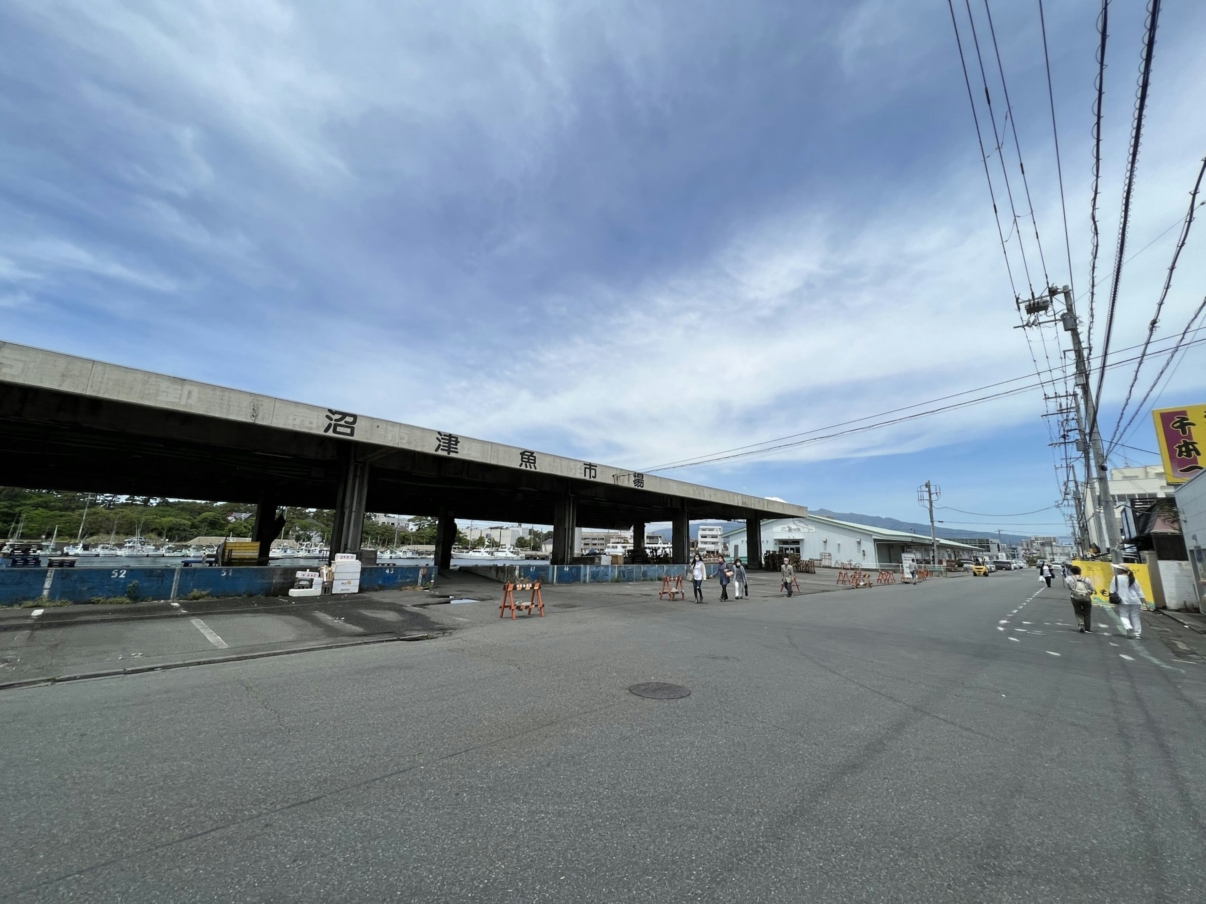 Coastal road with an overpass under a blue sky with clouds