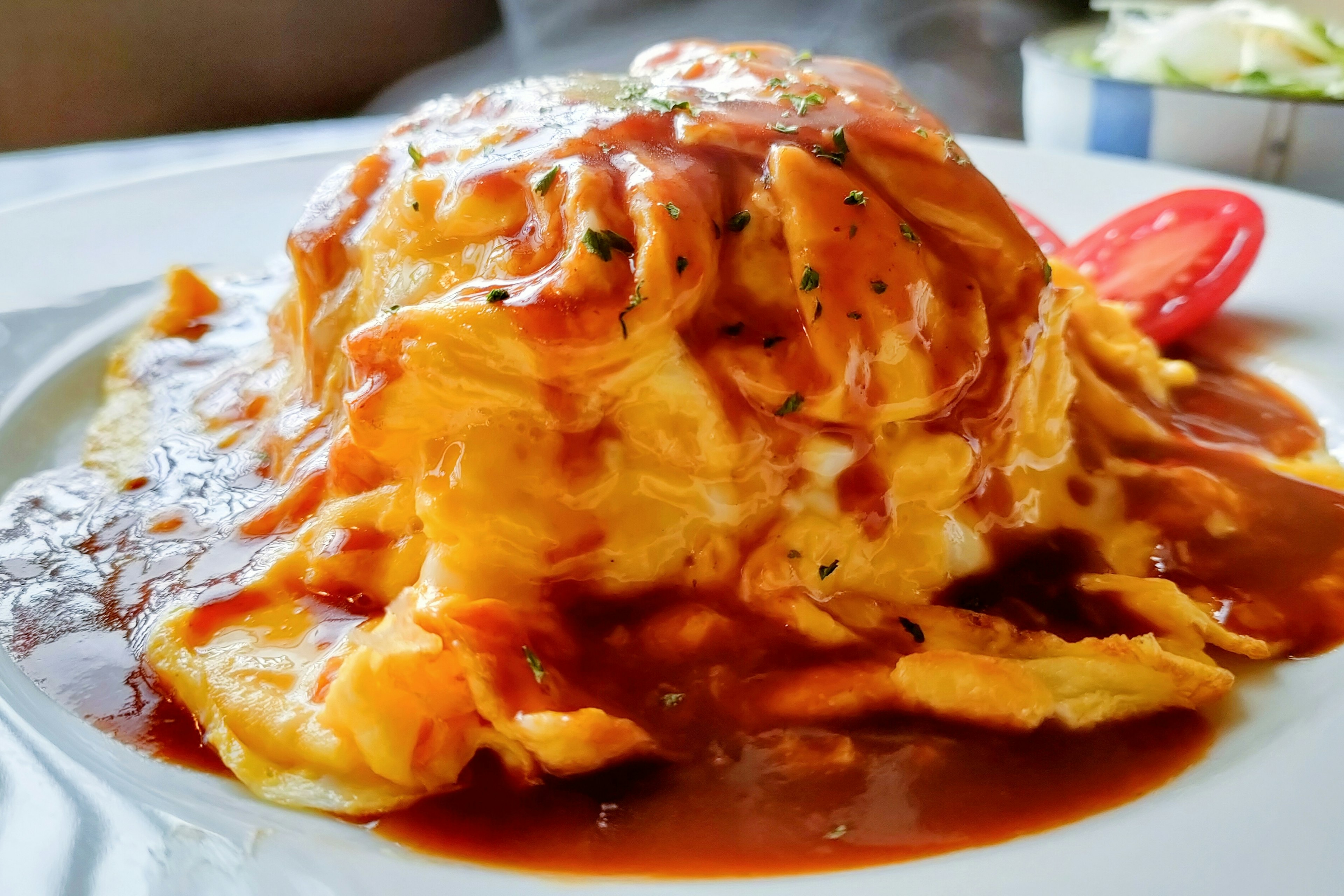 Fluffy omelette rice topped with tomato sauce