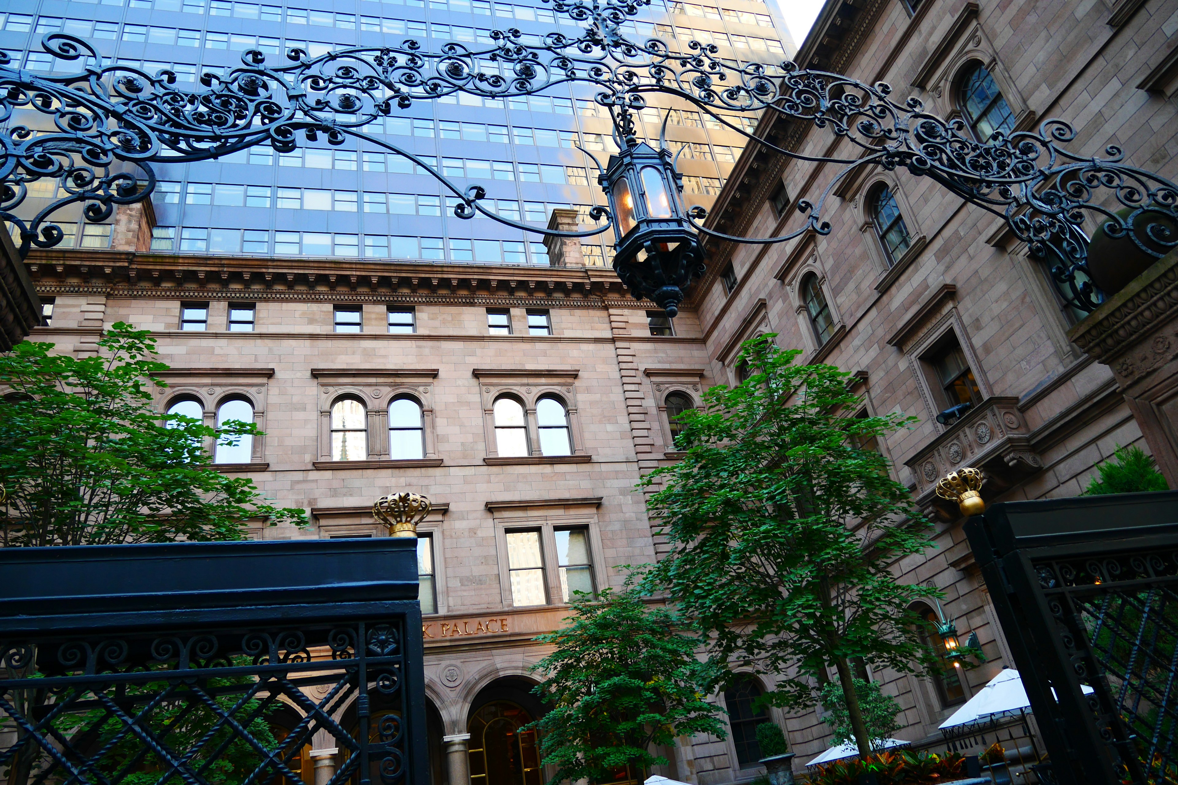 Historic building with lush greenery and ornate archway