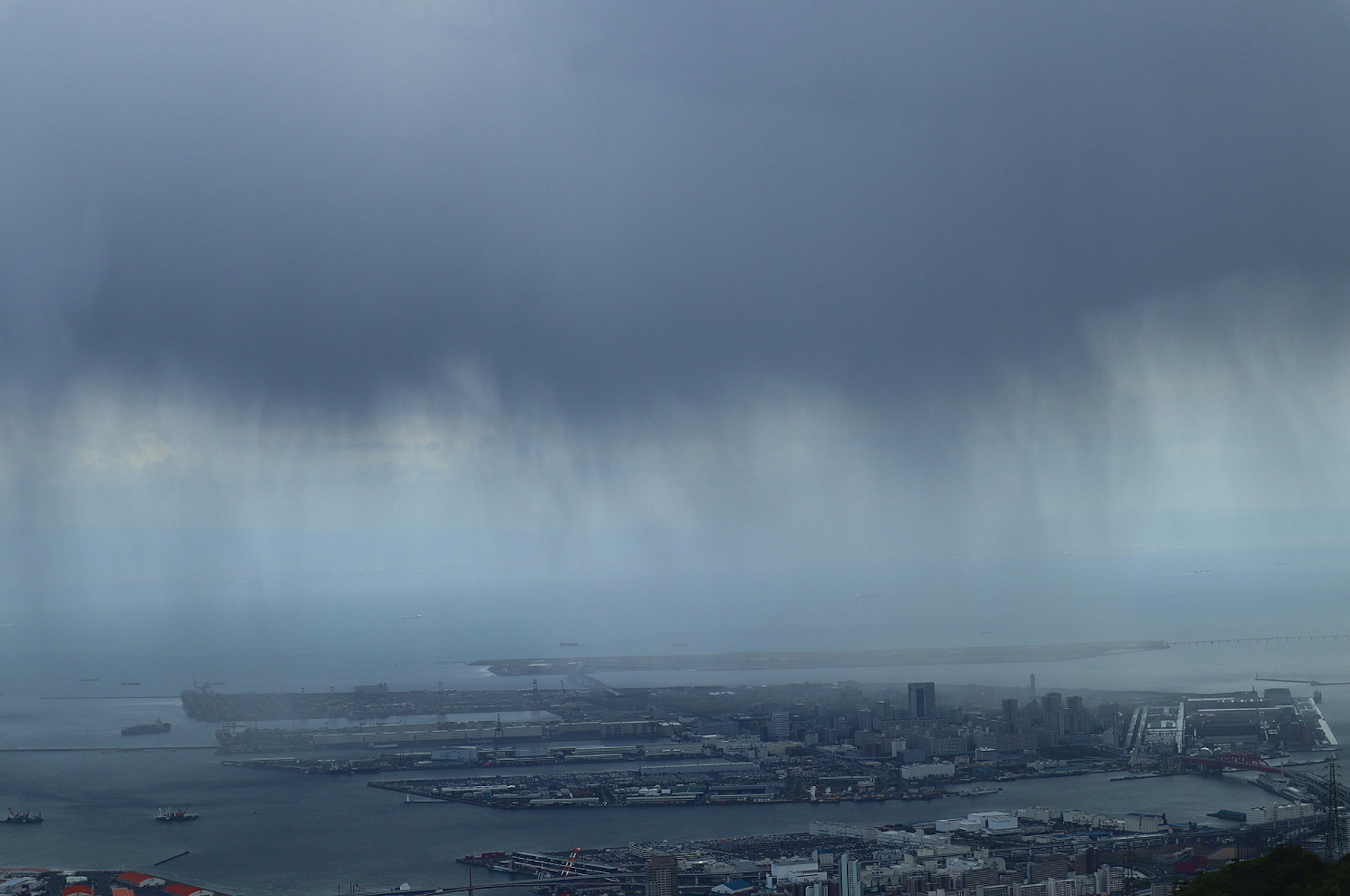 Overcast view of a harbor with dark clouds and impending rain