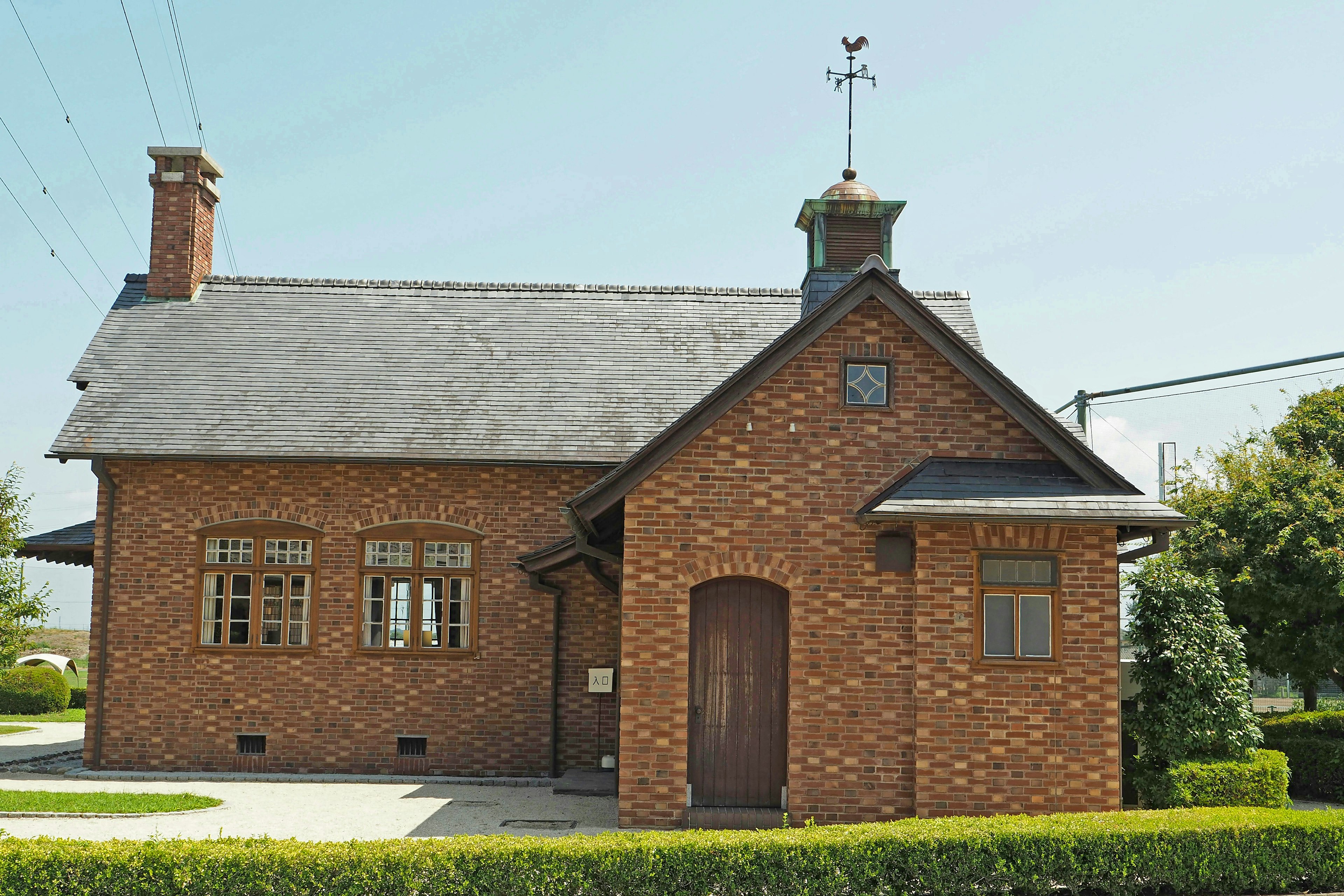 Brick house with a sloped roof and a chimney