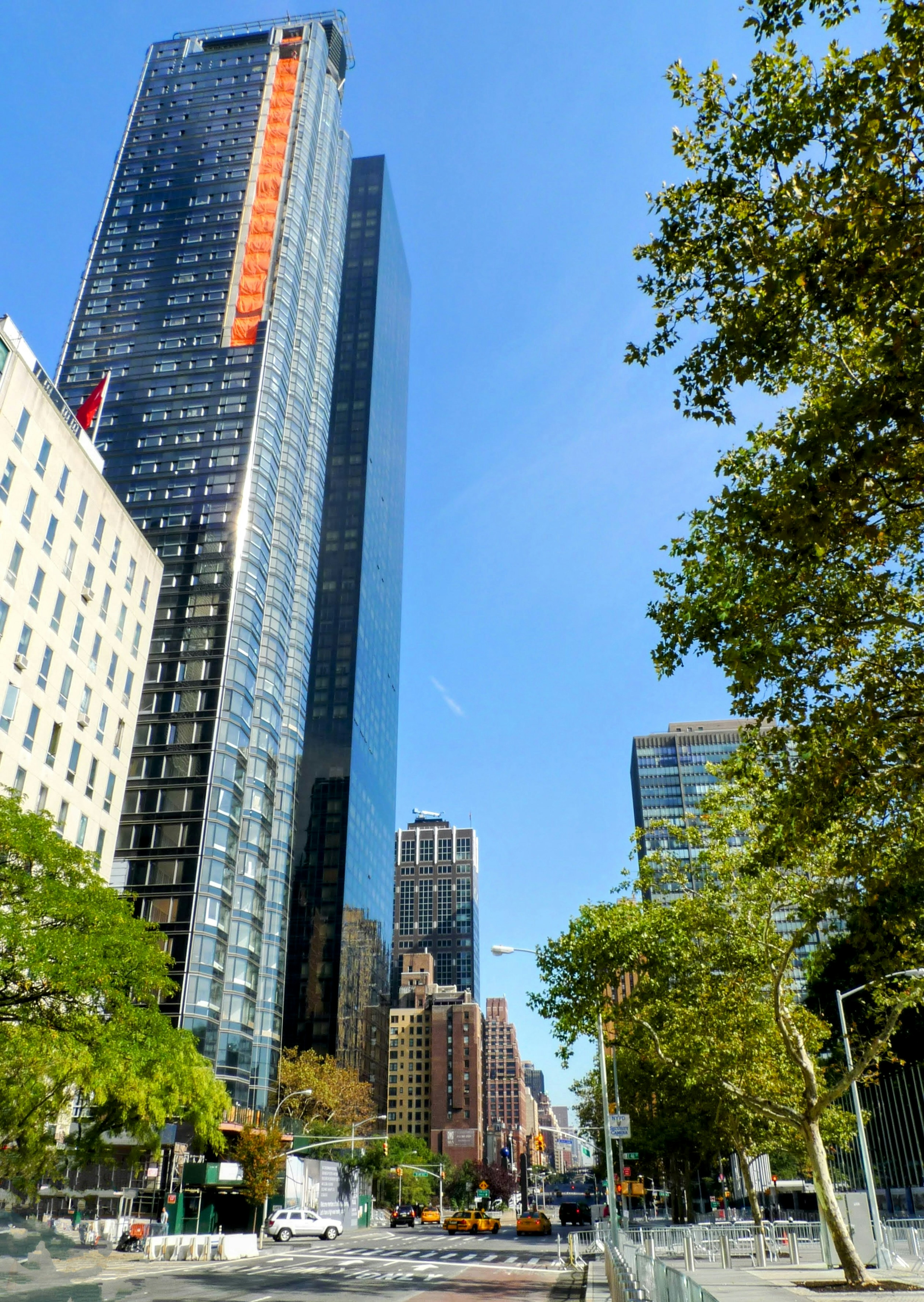 Urban skyline featuring tall buildings and clear blue sky