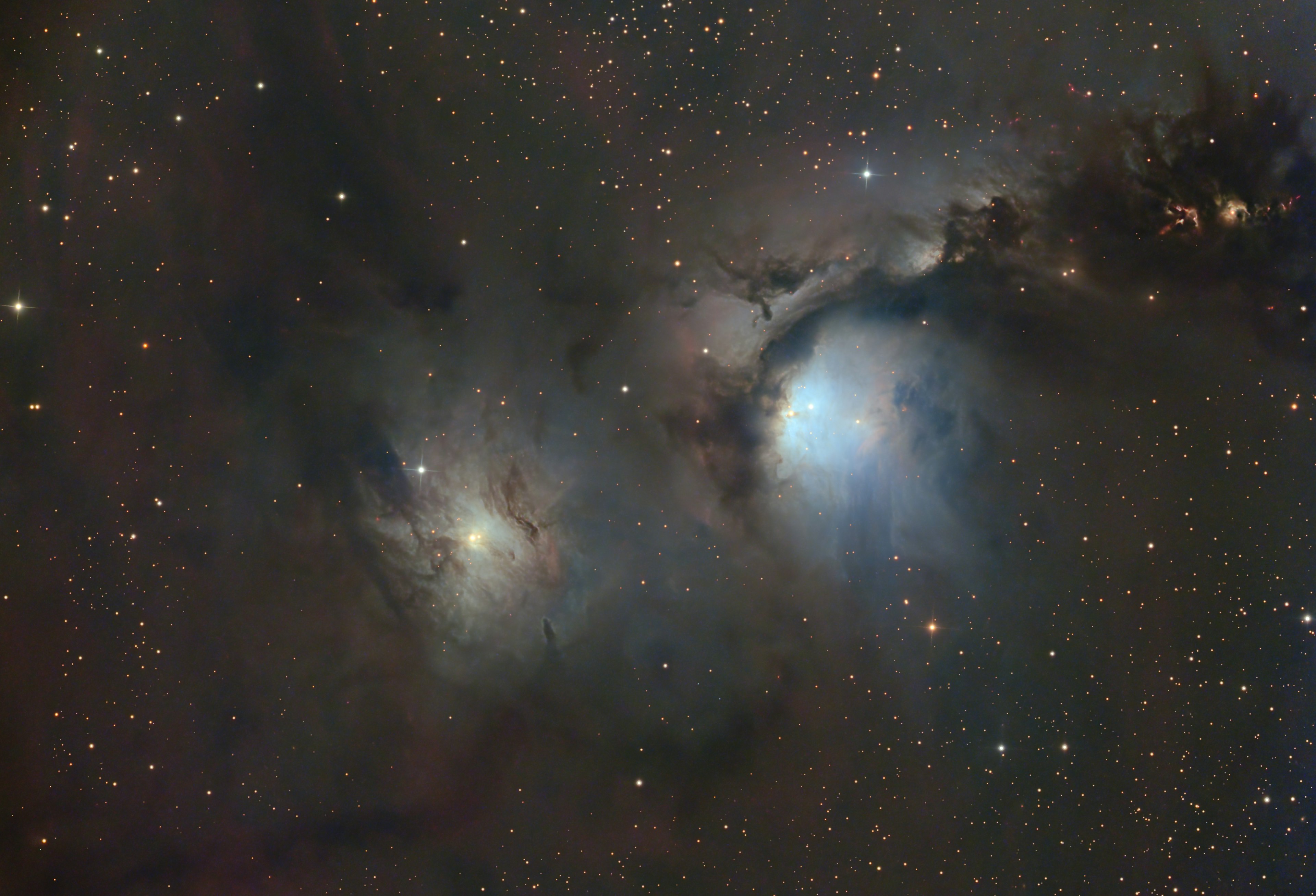 A stunning astrophotography image showcasing a nebula and twinkling stars