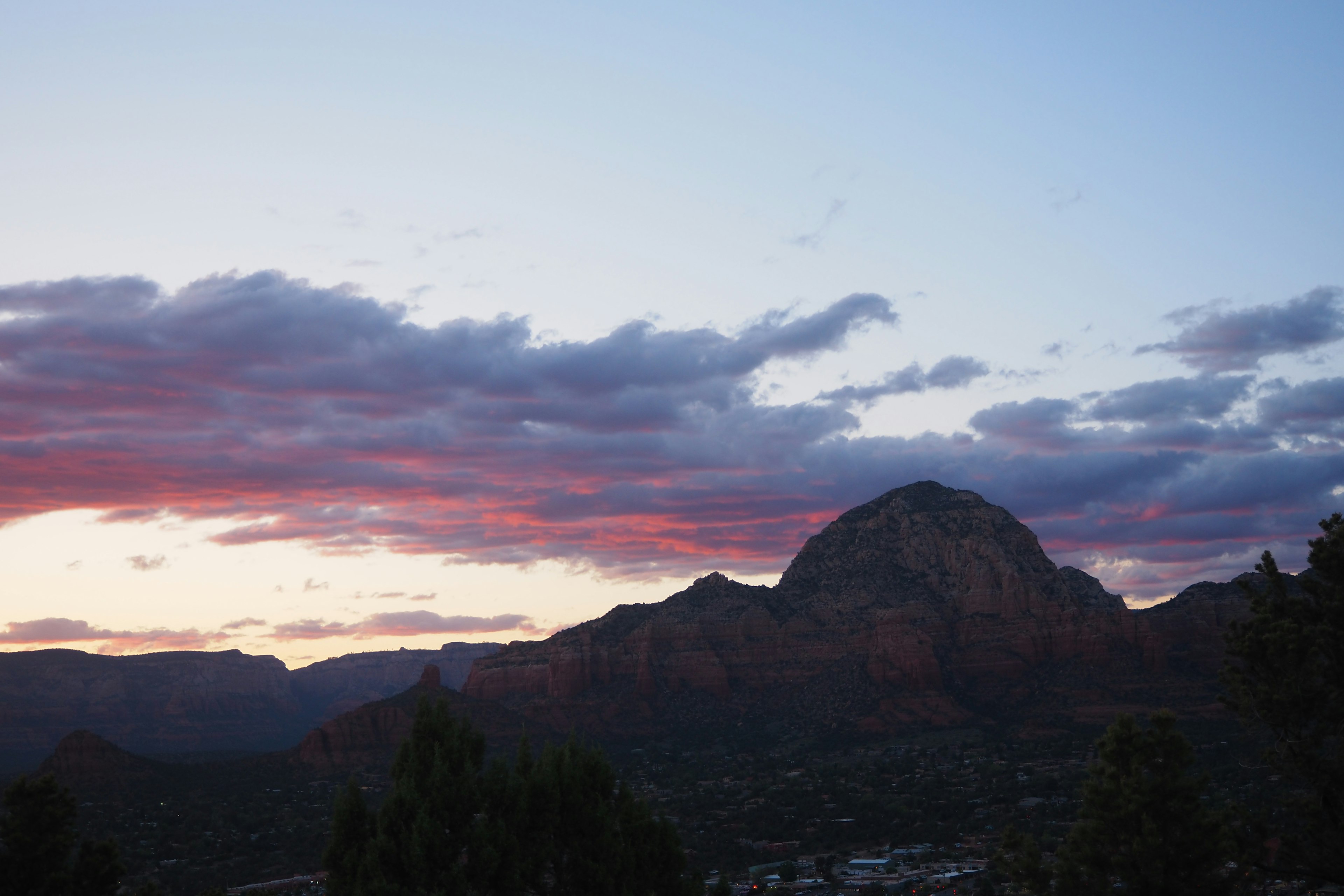 Scenic view of a sunset sky with mountain silhouette