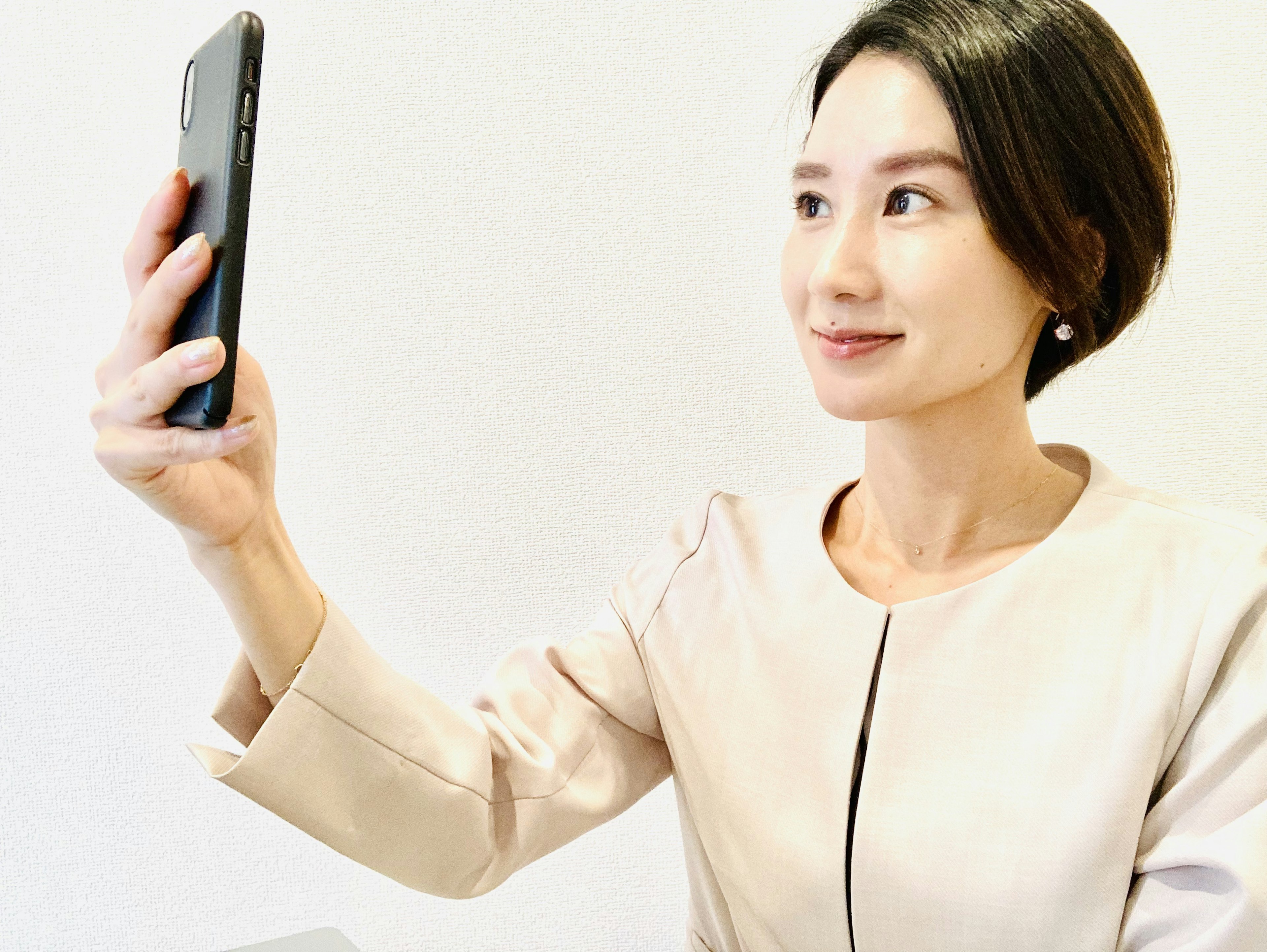 Woman taking a selfie with a smartphone