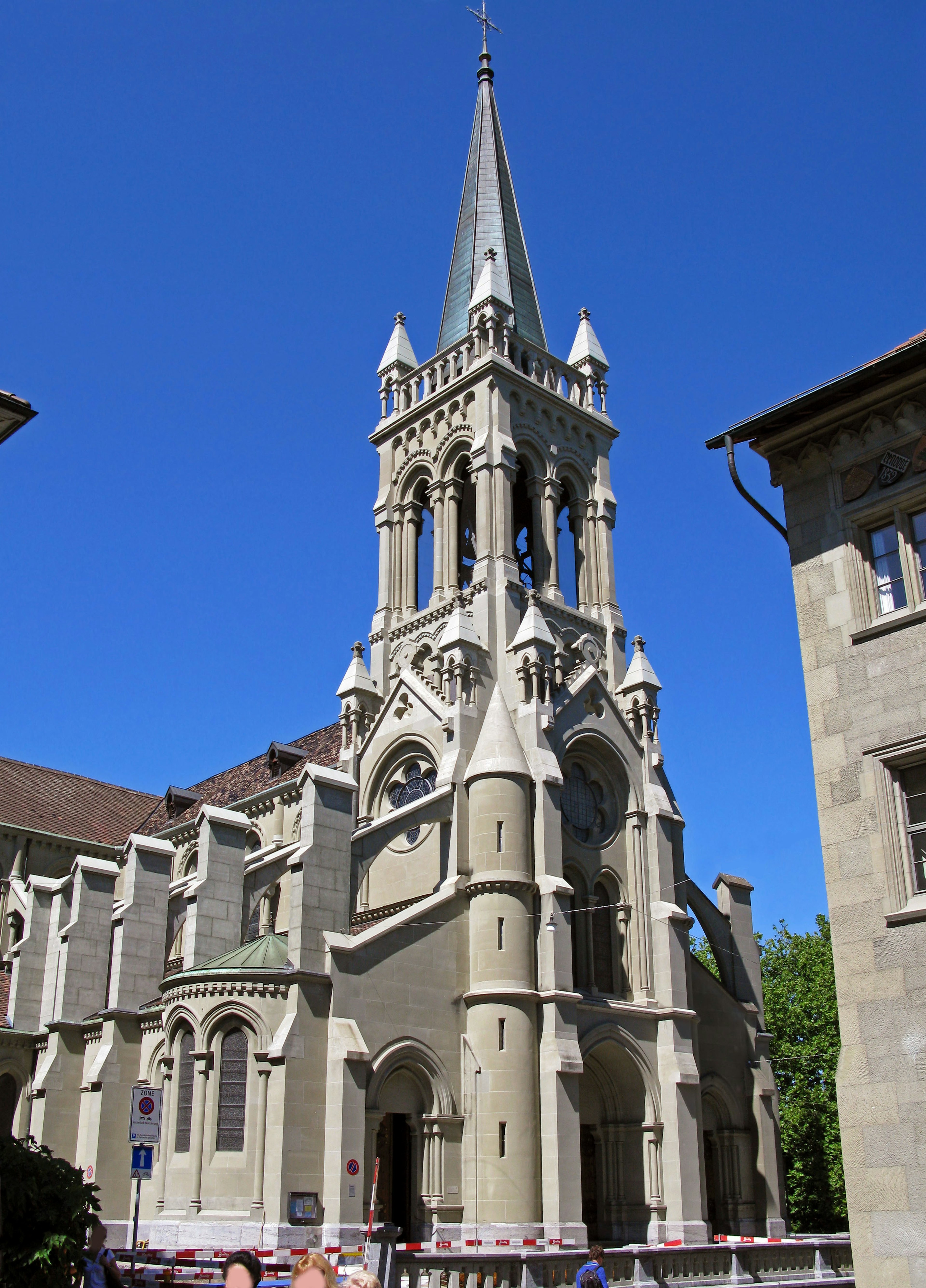 Exterior view of a historic building with a beautiful spire