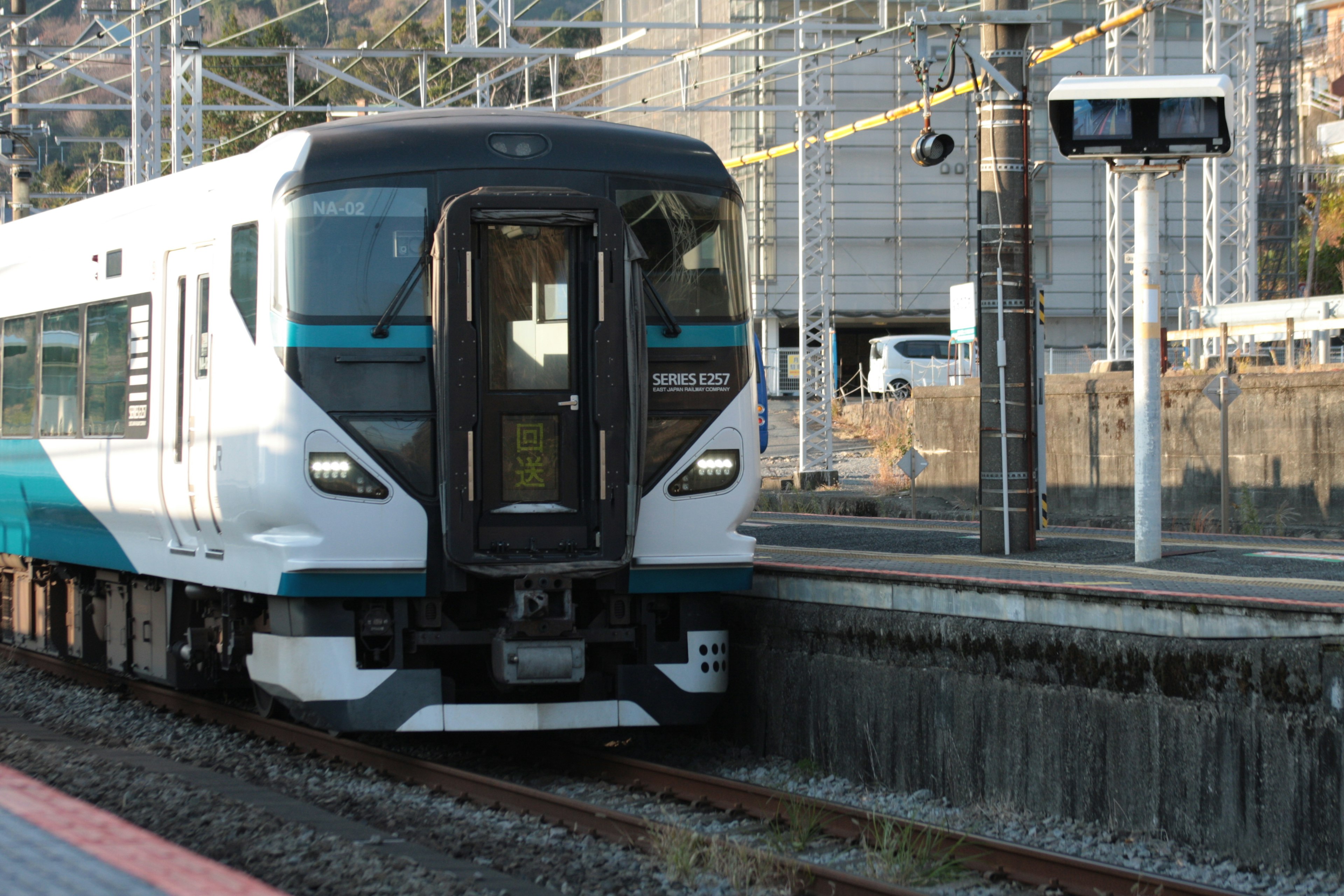 A modern train is stopped at a station