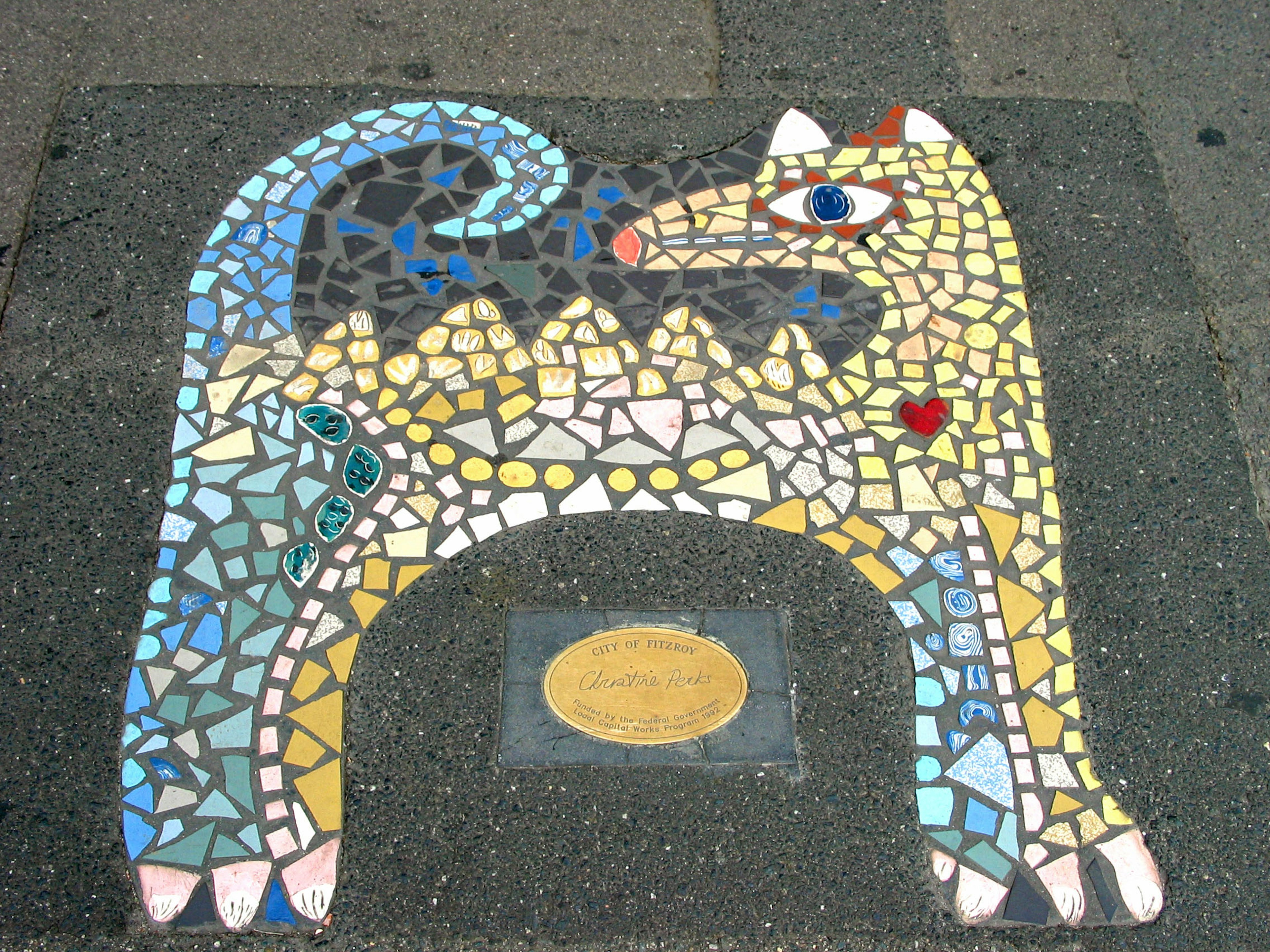 Colorful mosaic tile artwork depicting a cat design