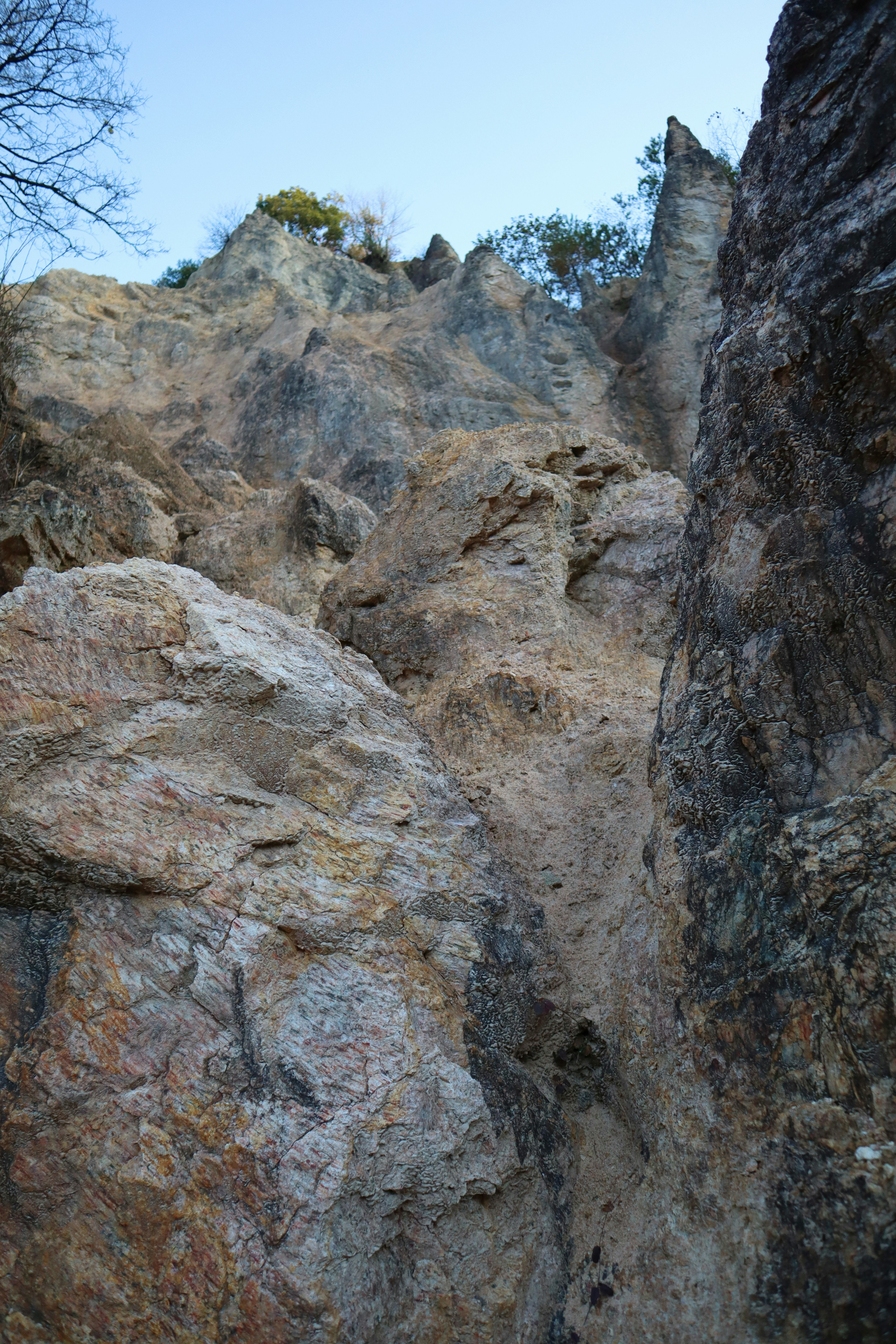 Photo of rocky cliff with blue sky above