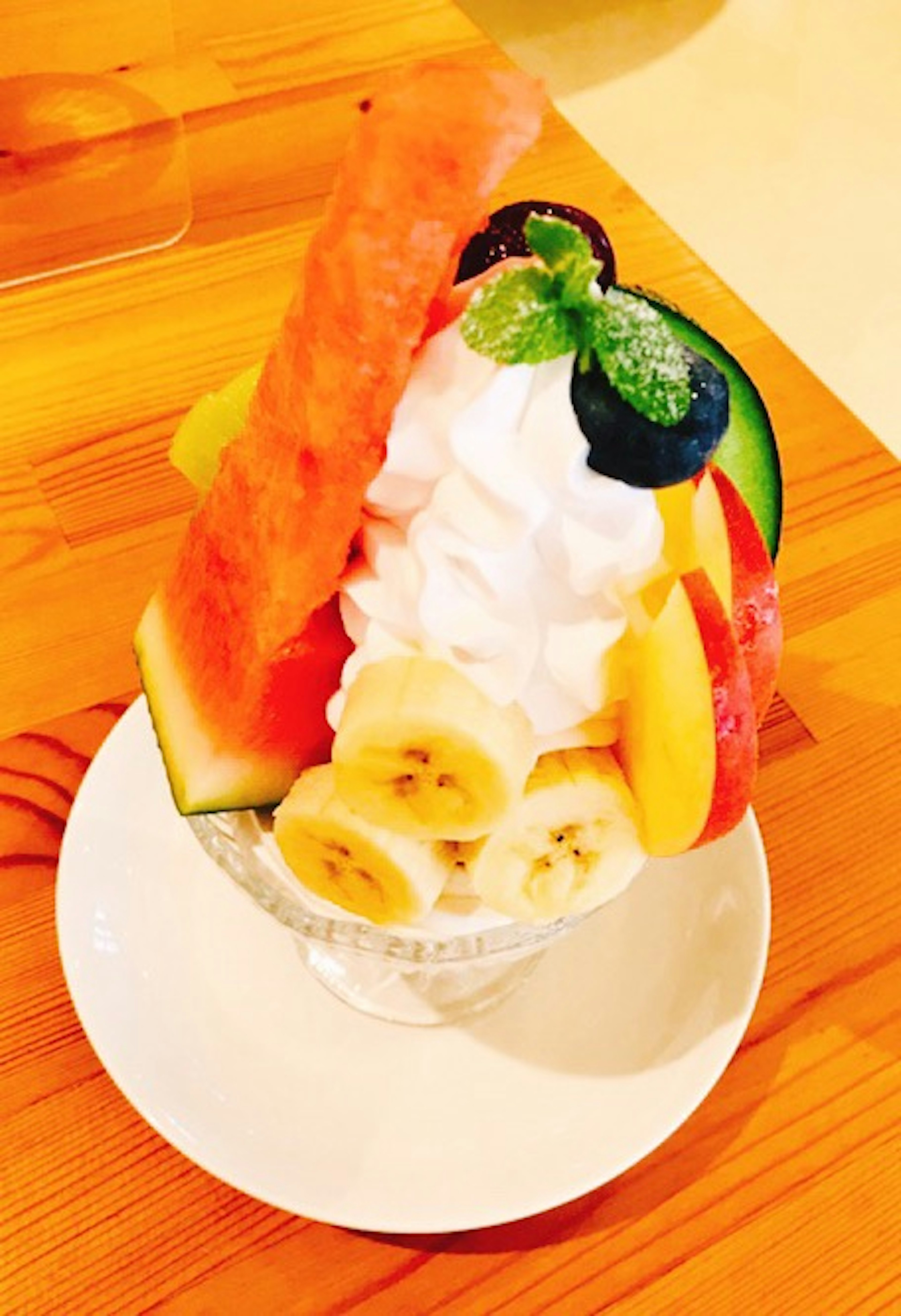 Colorful assortment of fruits and soft serve ice cream