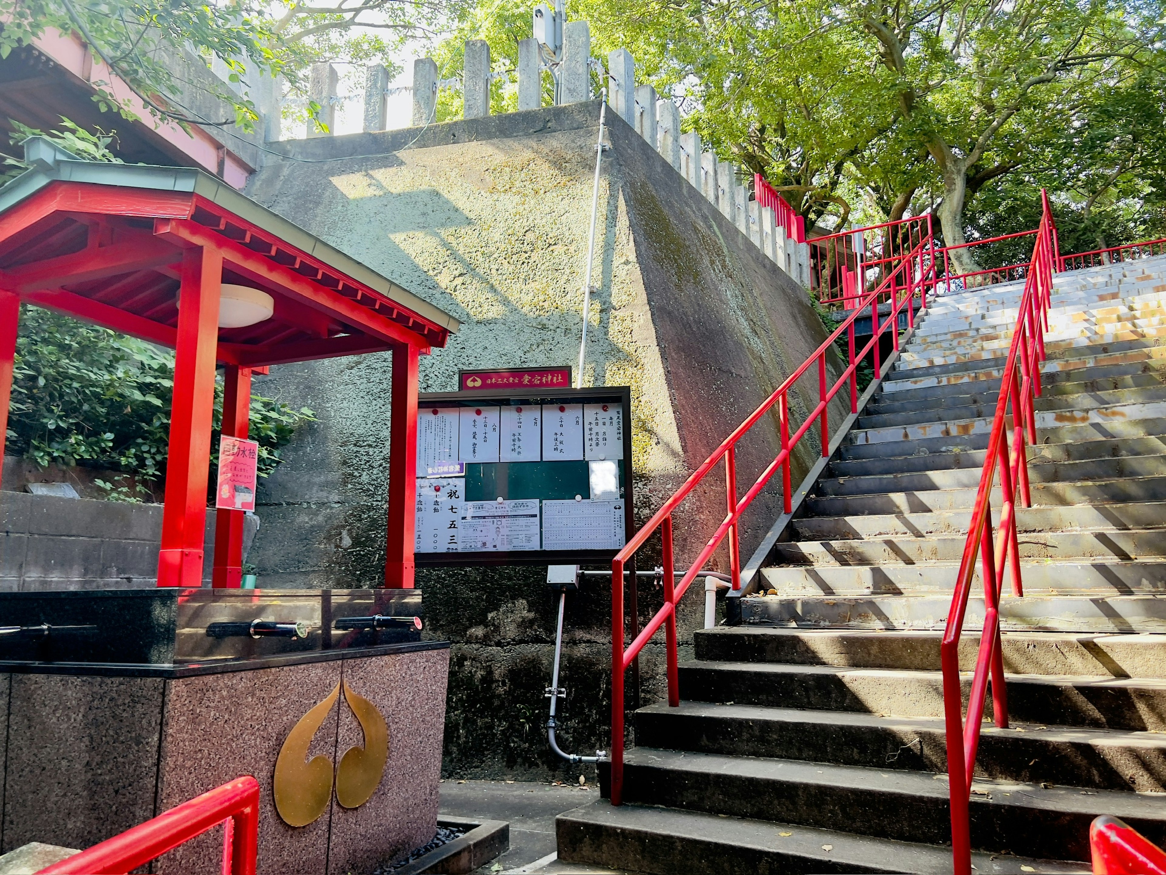 View of red stairs and a shrine gate