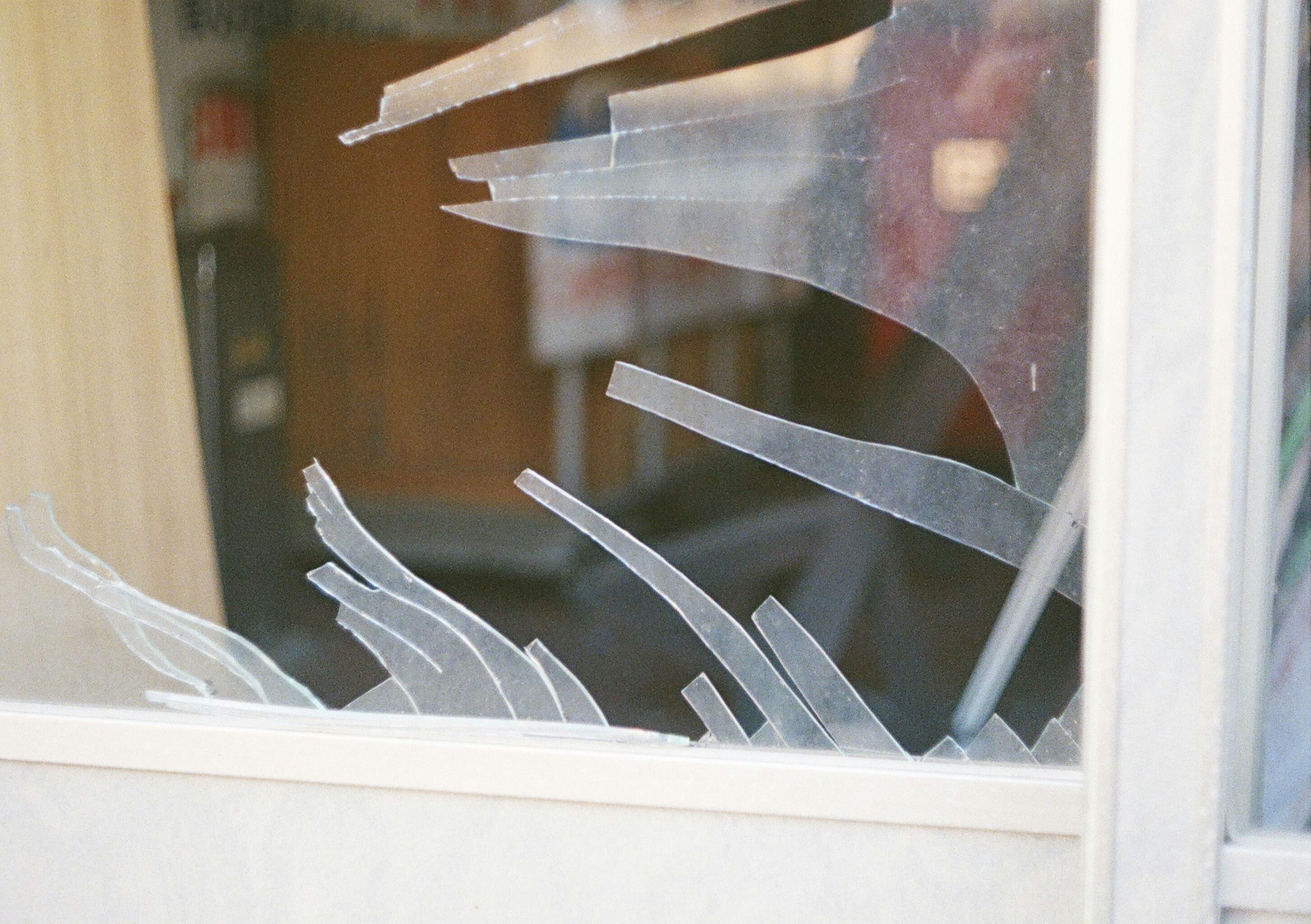 Image of shattered glass fragments in a window