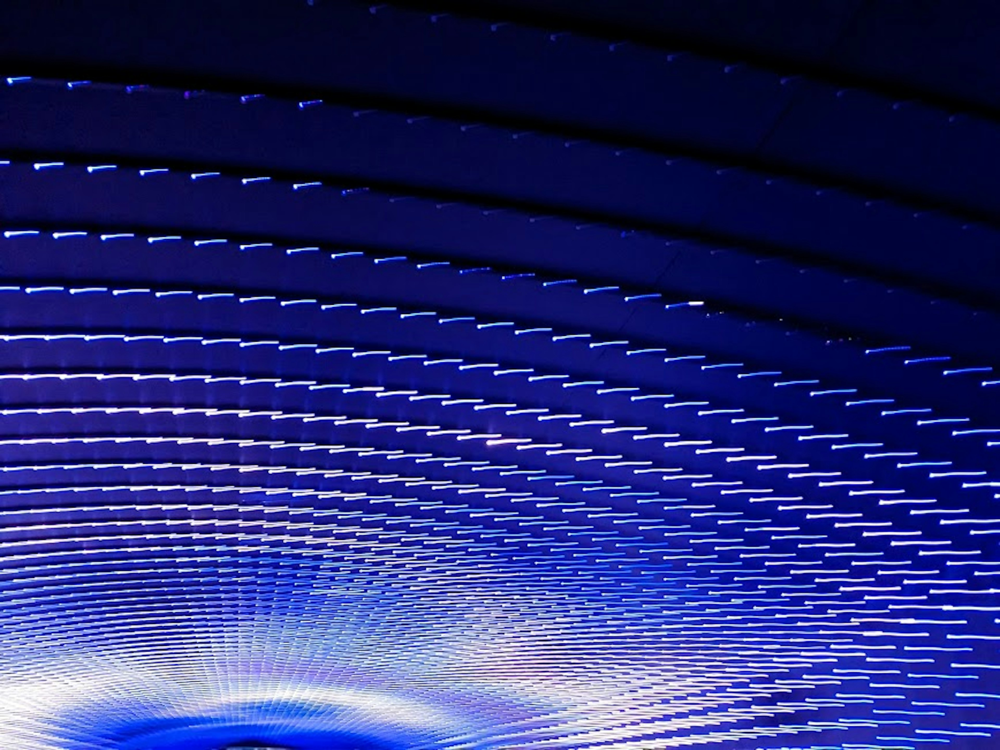 Abstract design featuring waves of blue light