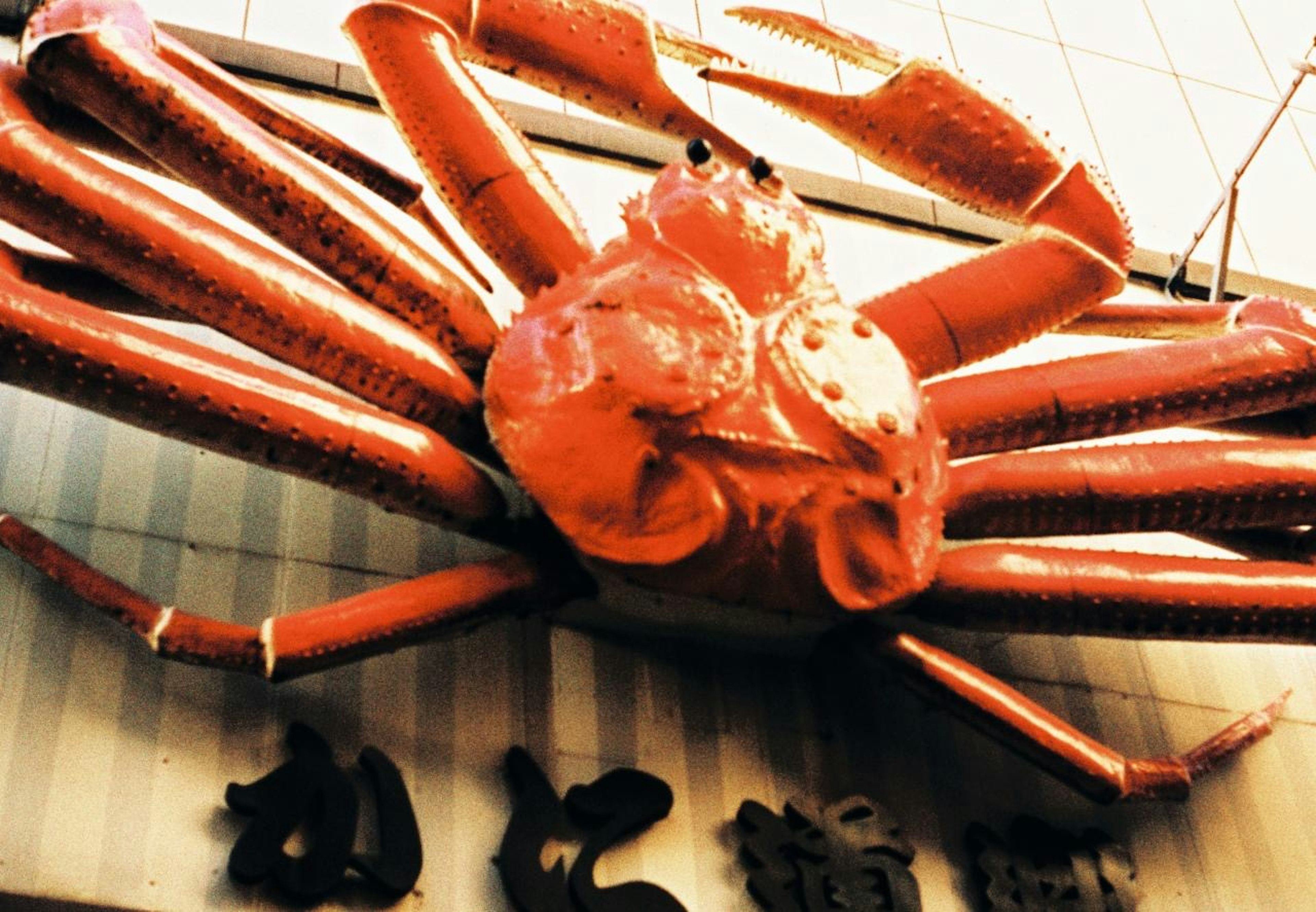 A striking red crab sign on a restaurant exterior