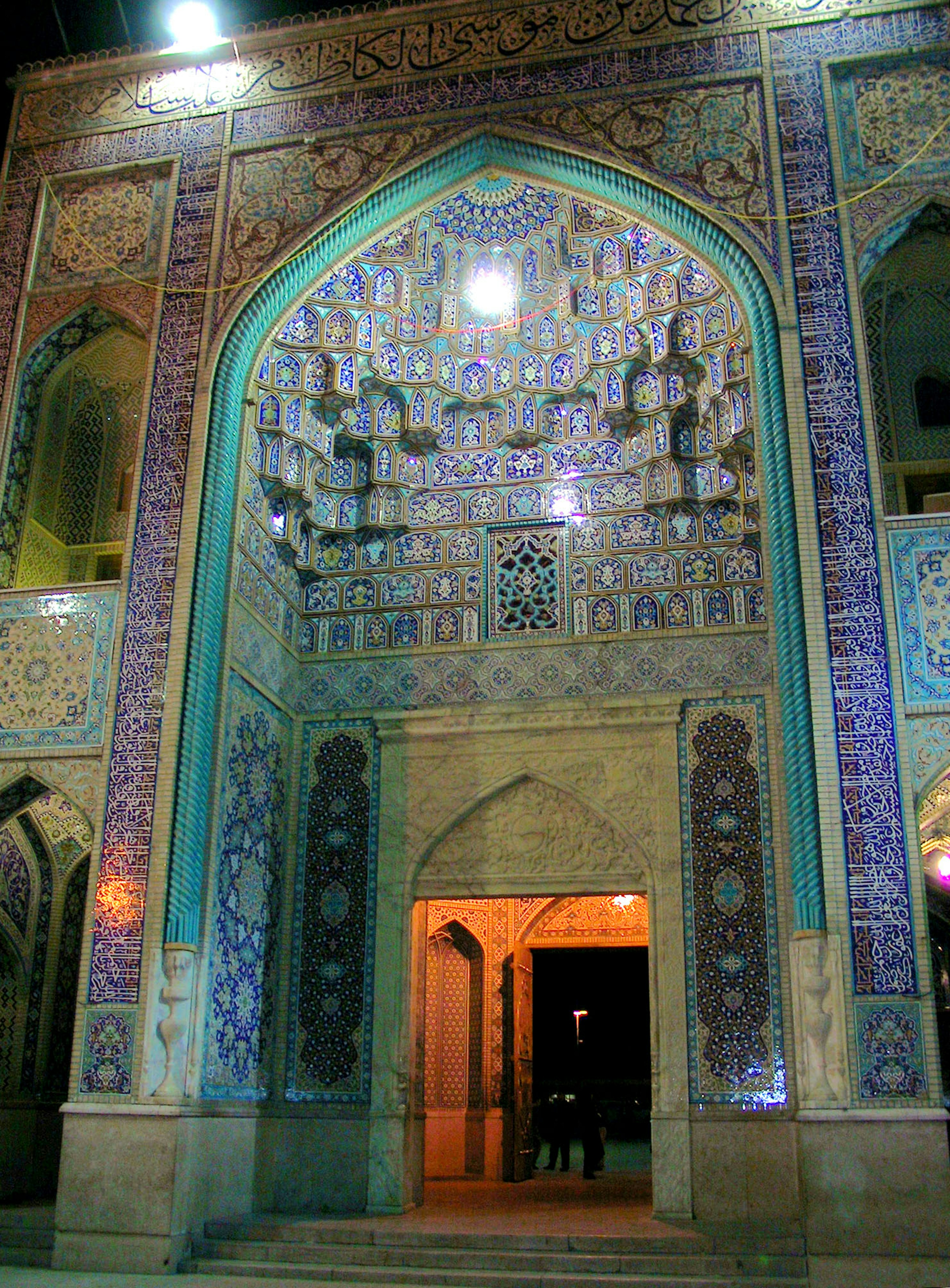 Beautifully tiled arched entrance with illuminated interior