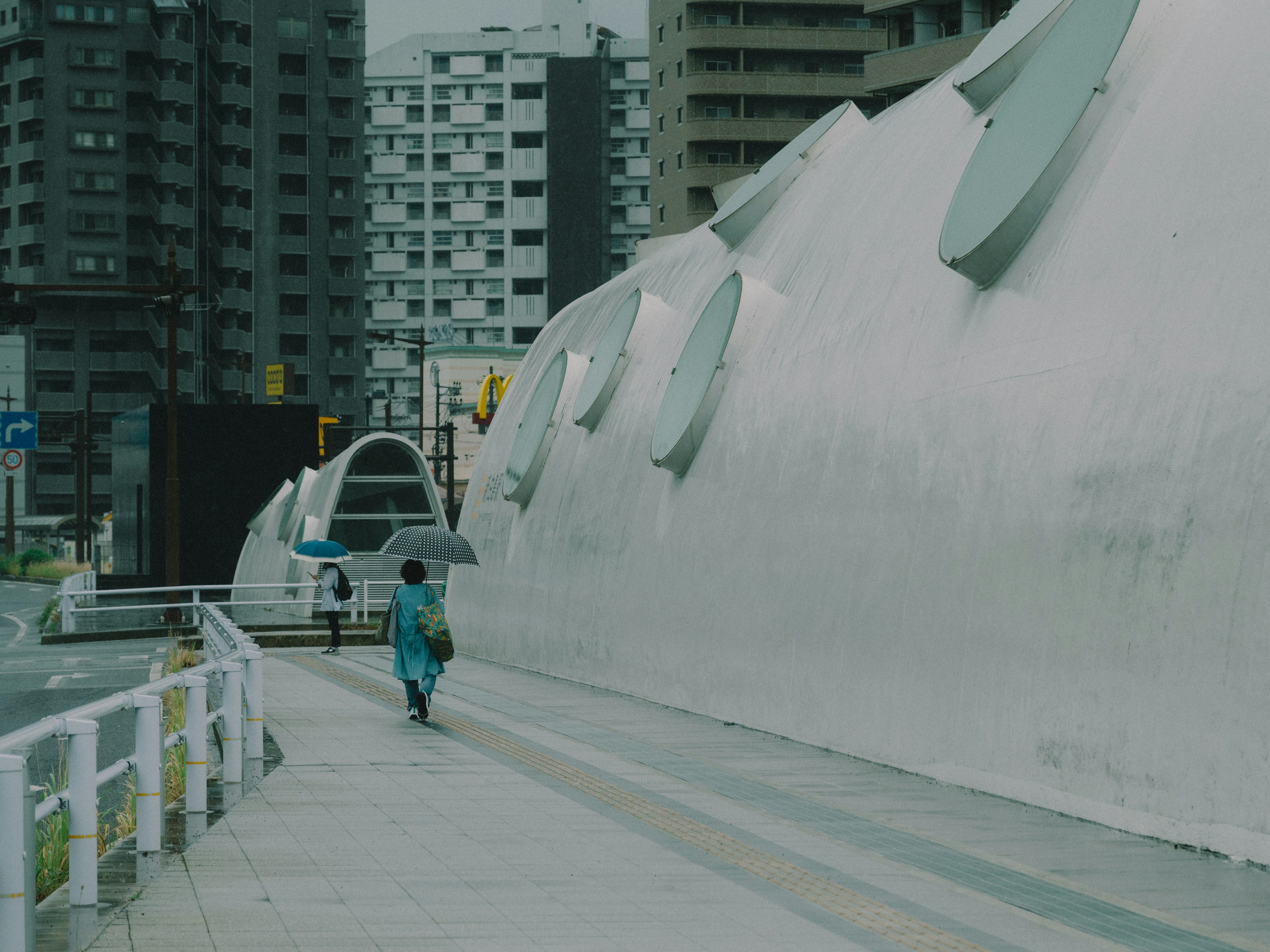 Urban scene with a person walking and modern architecture