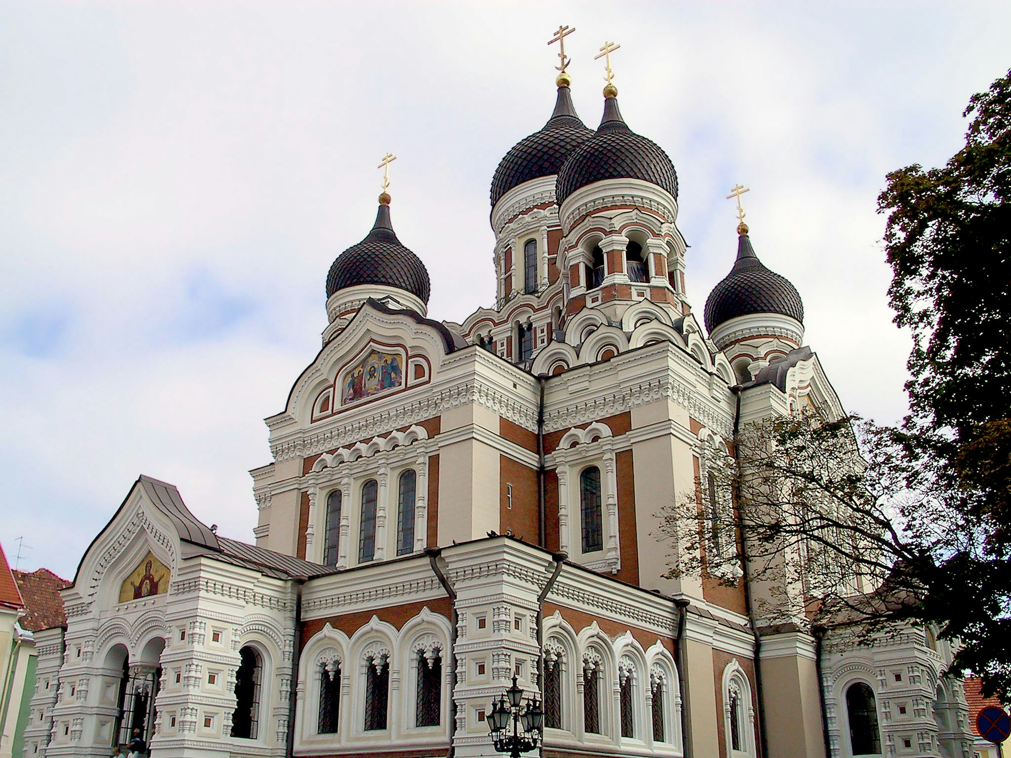 Beautiful church building in Estonia featuring black domes and ornate architecture