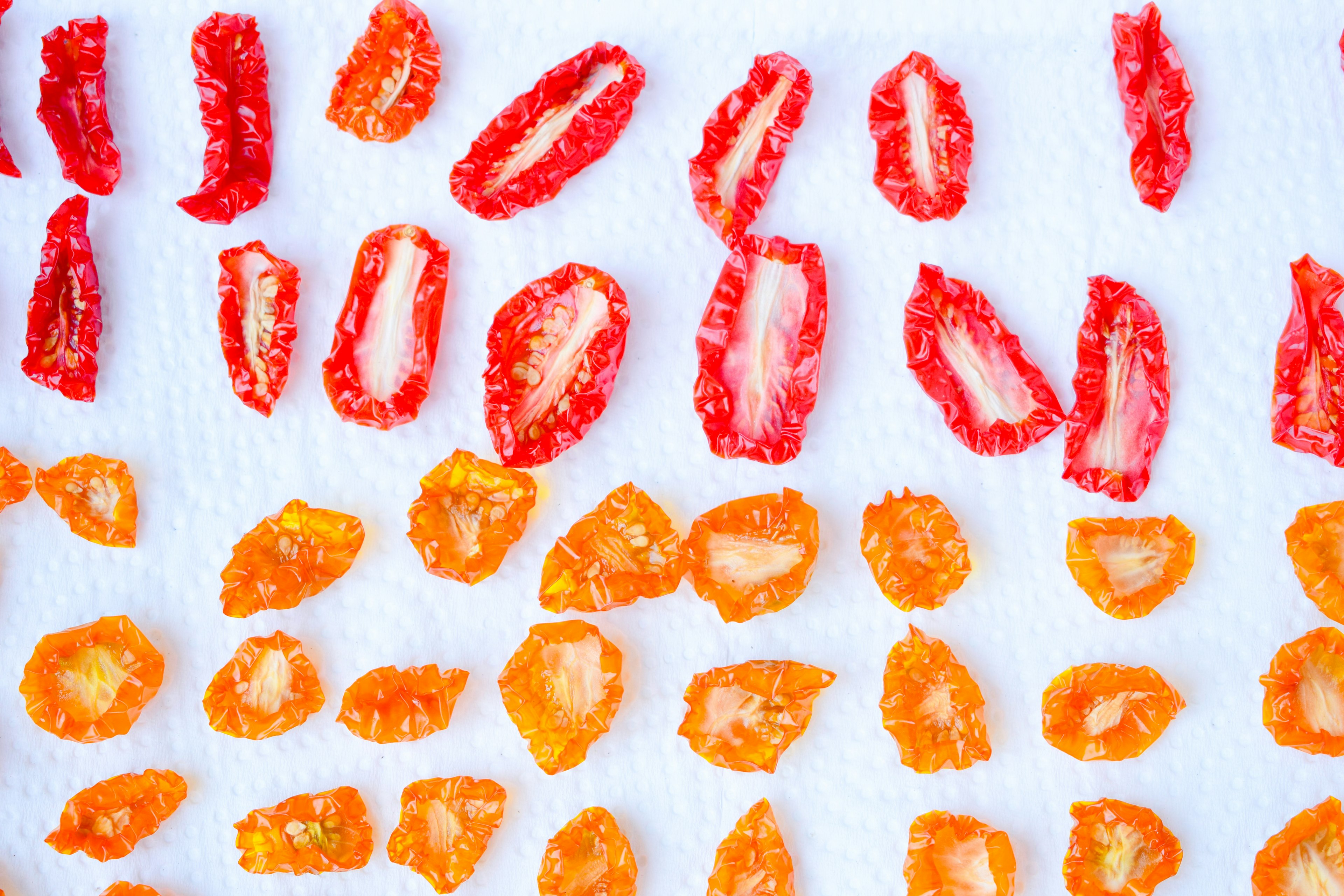 Dried fruit slices in red and orange arranged in a pattern