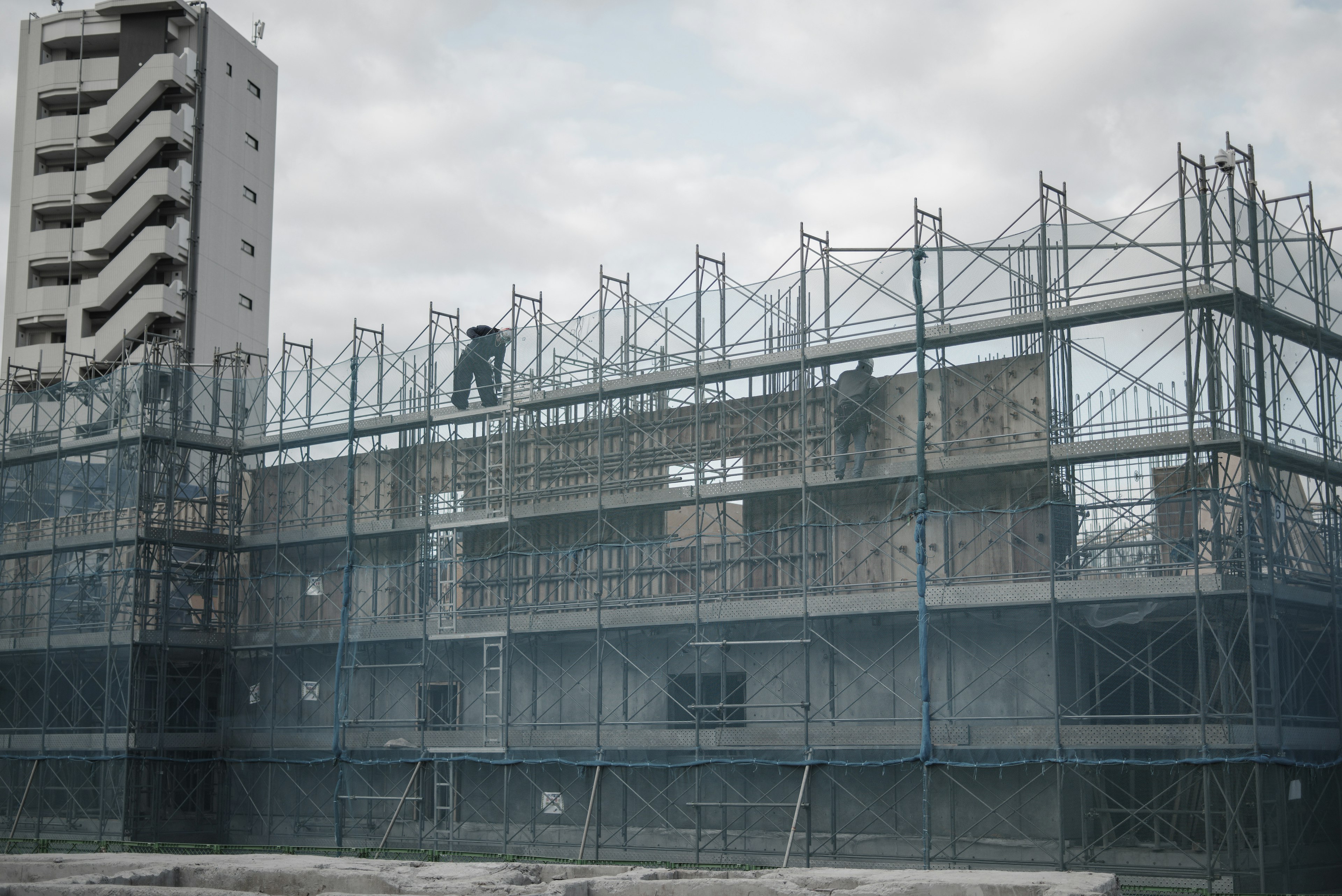 Construction site with scaffolding and building