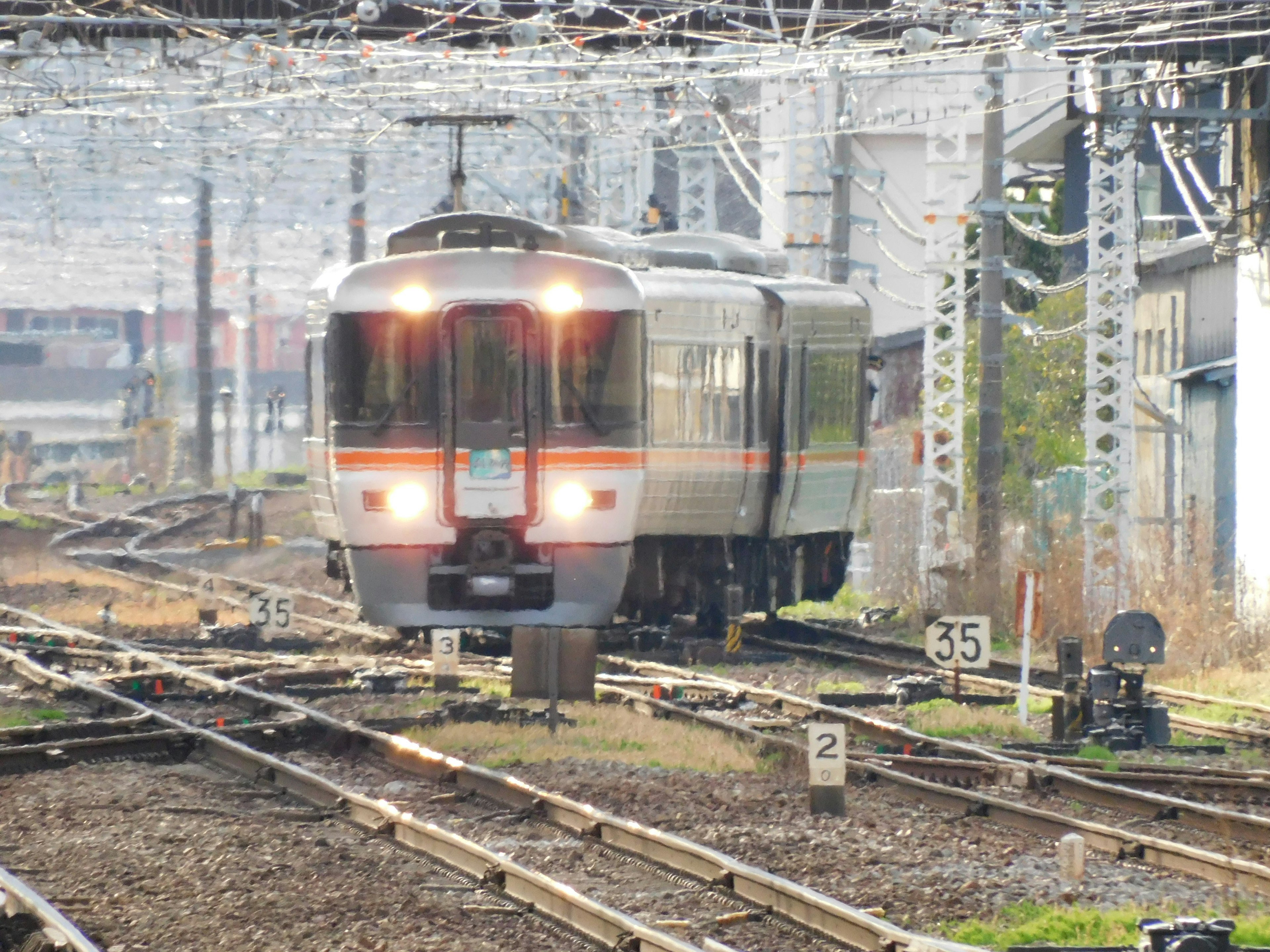 Train on railway tracks in a station setting