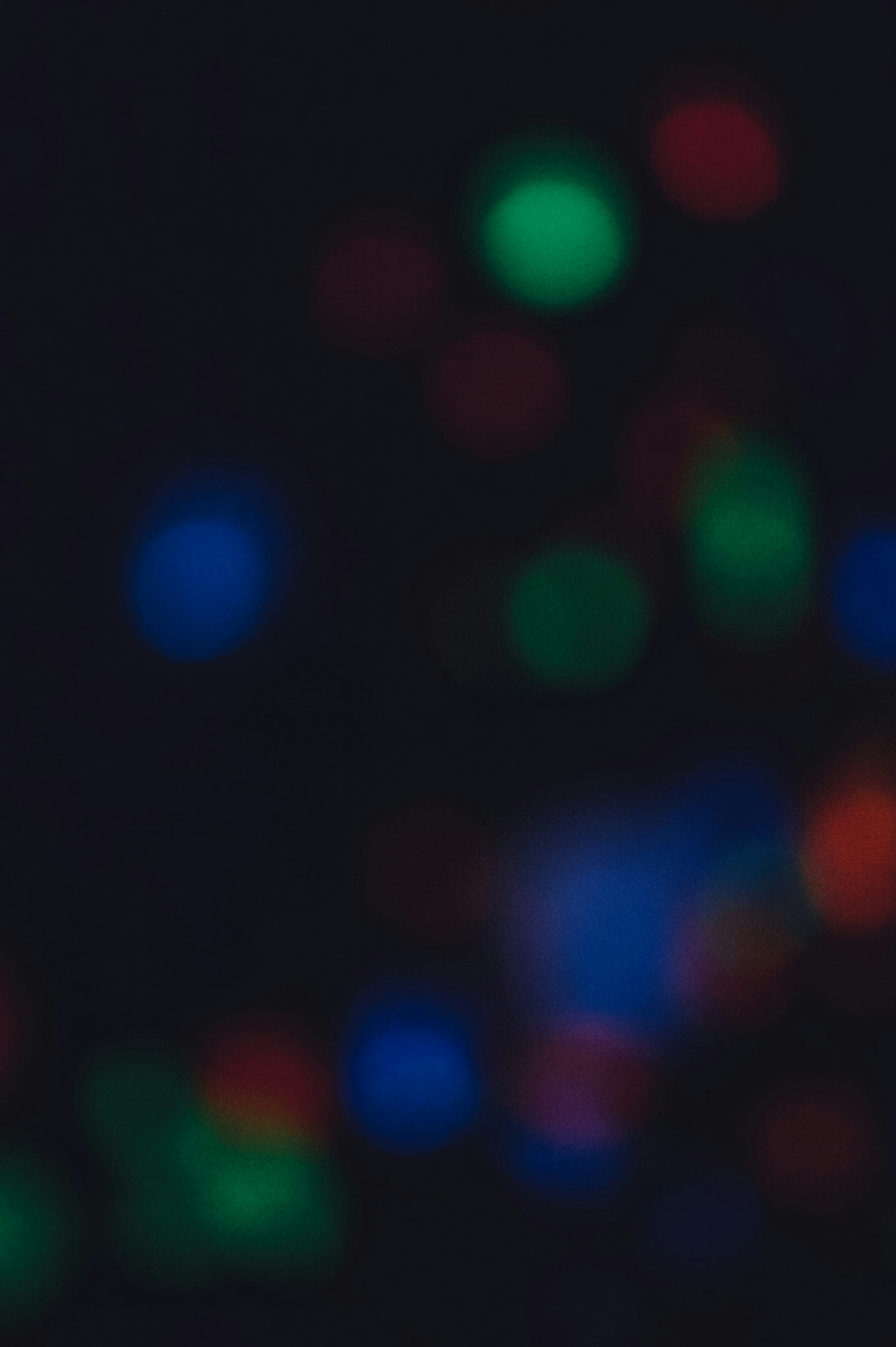 Blurry colorful lights against a dark background