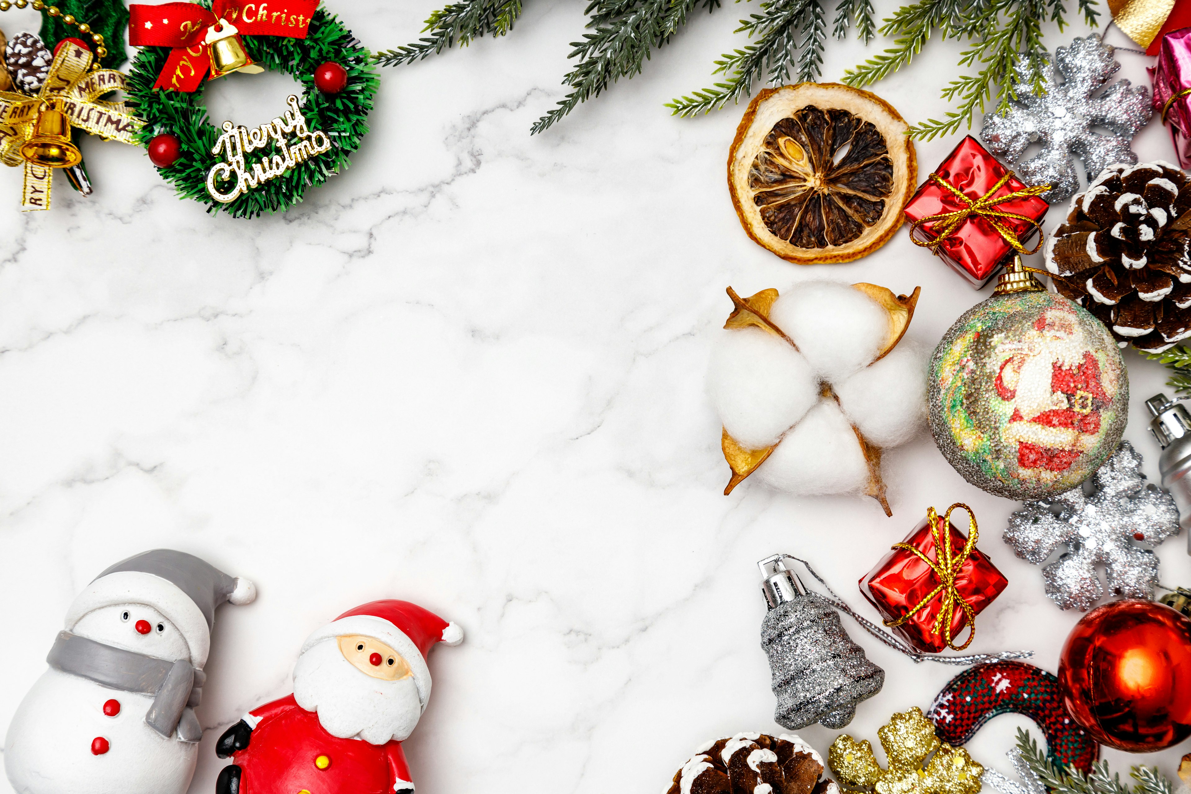 Christmas decorations and items arranged on a marble background