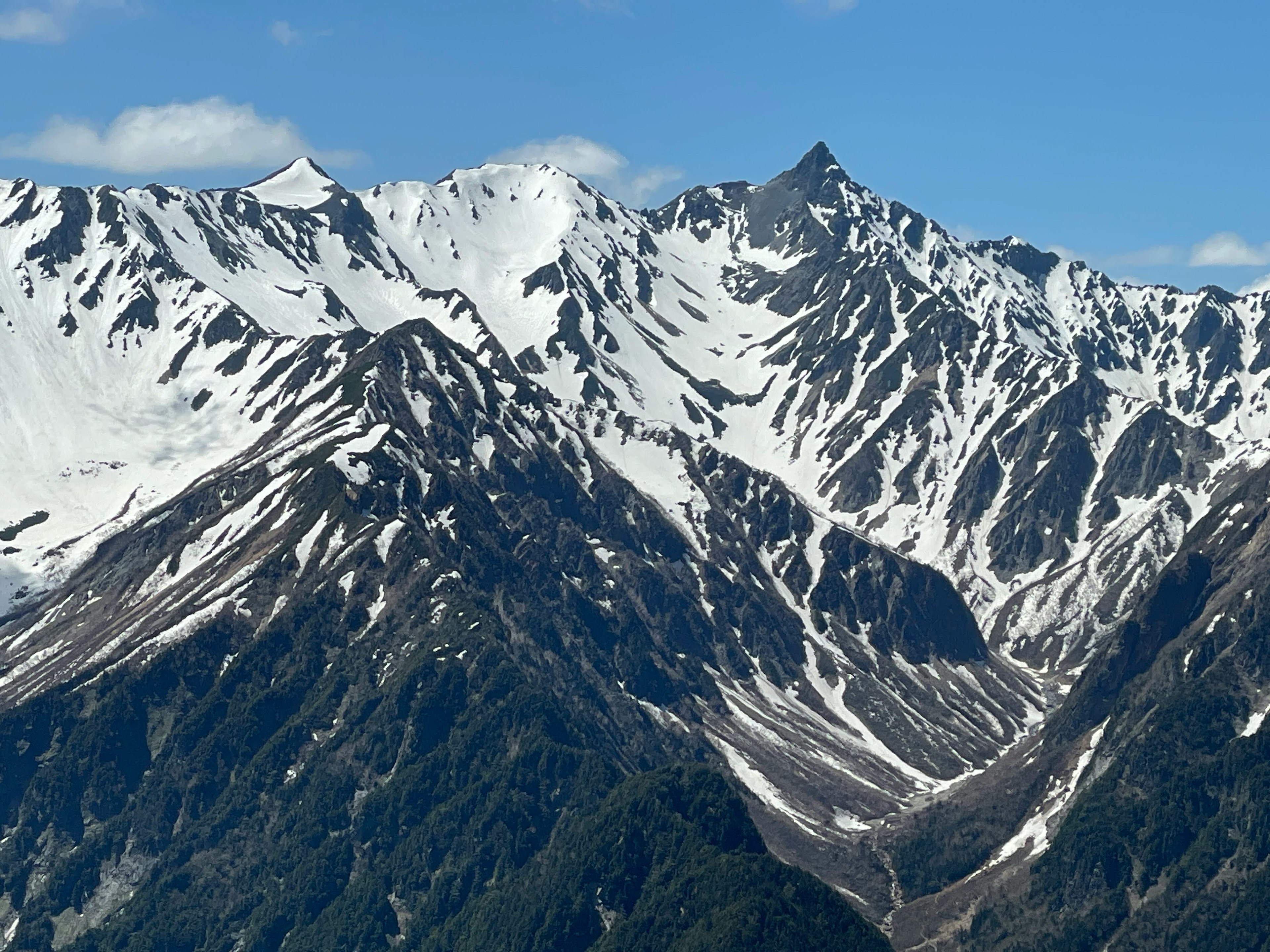 Snow-covered mountain landscape with rugged peaks