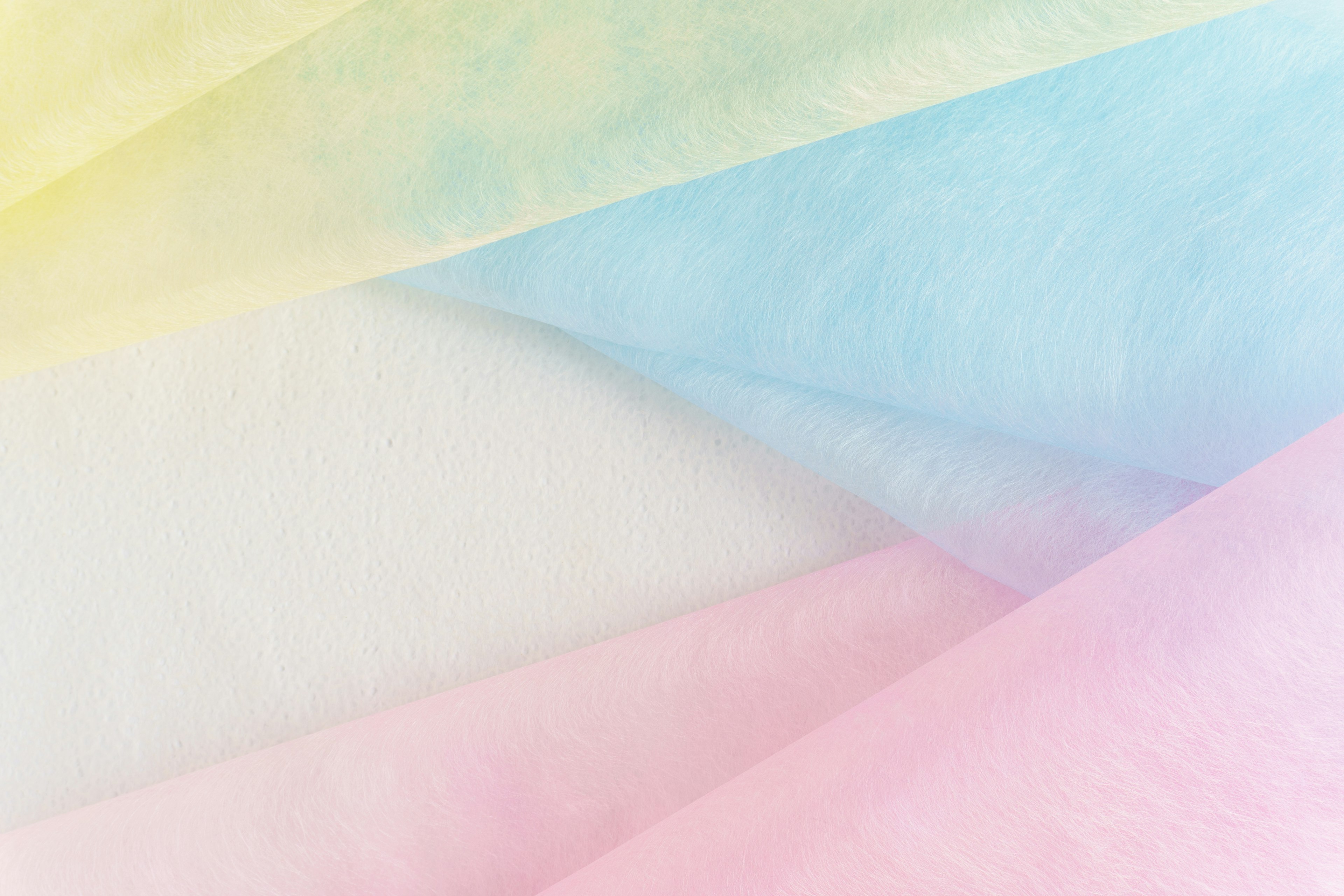 Soft pastel colored fabrics layered together