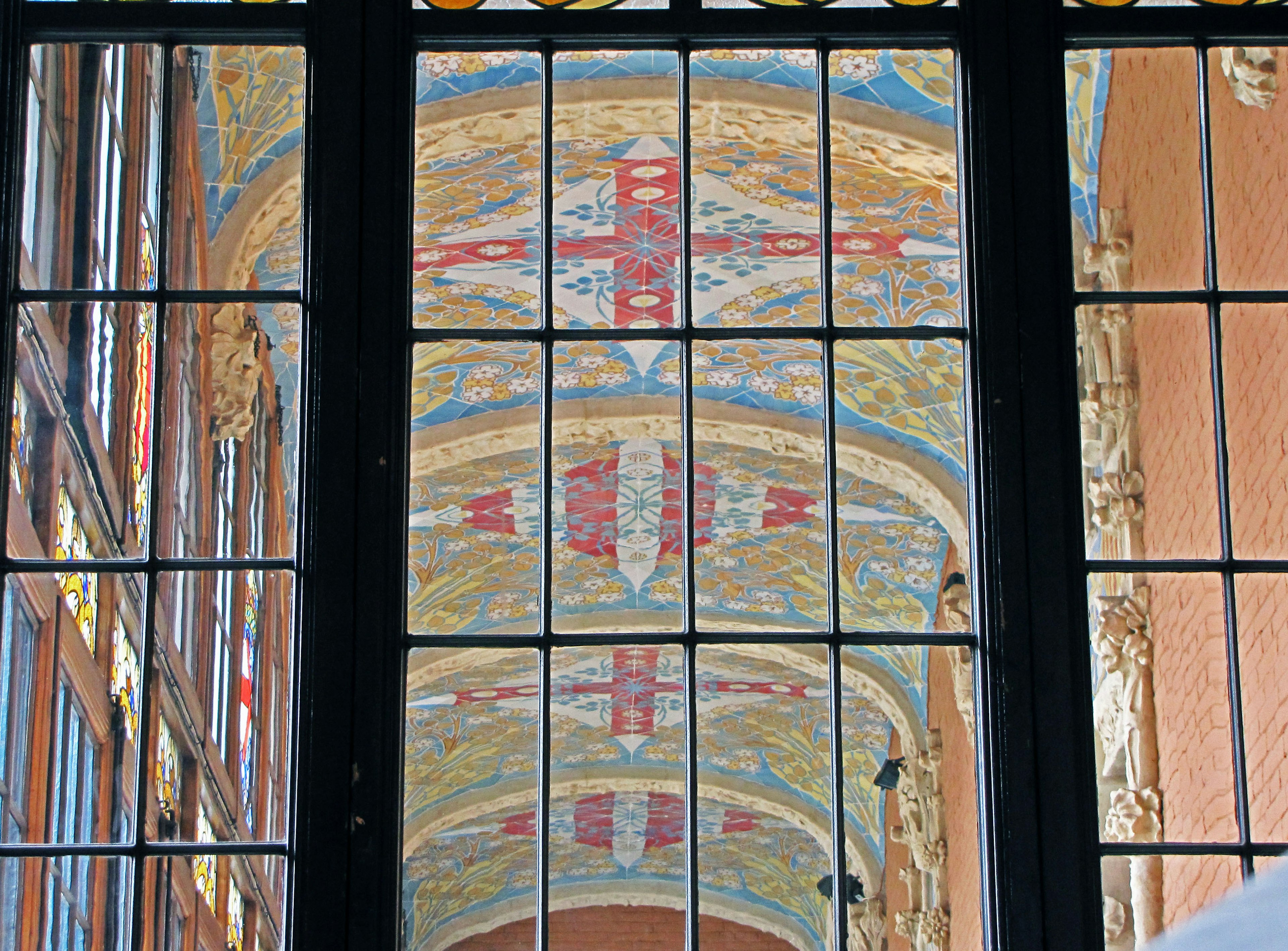 Beautiful ceiling decoration and colors viewed through a window