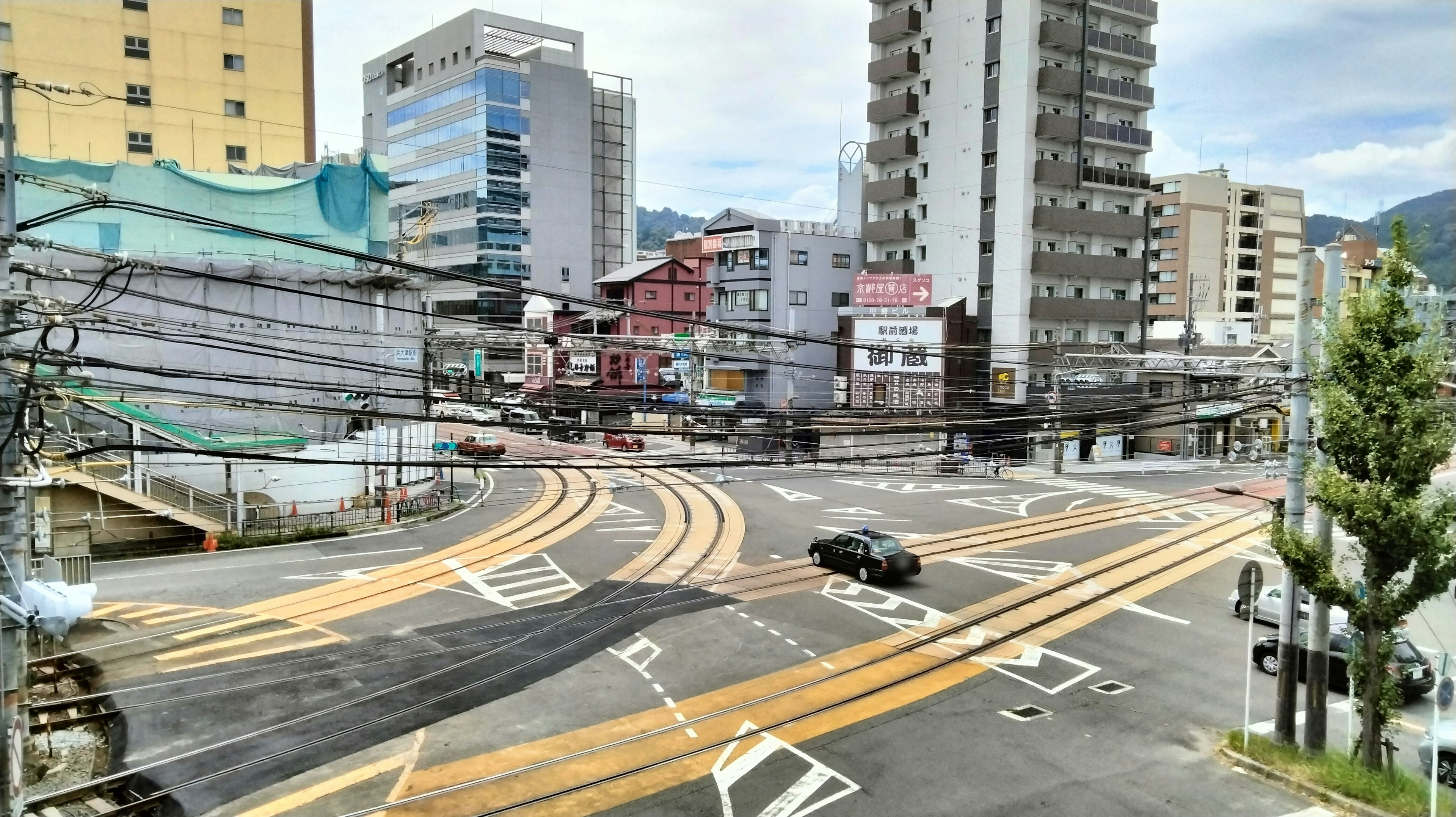 Urban intersection featuring roads and buildings