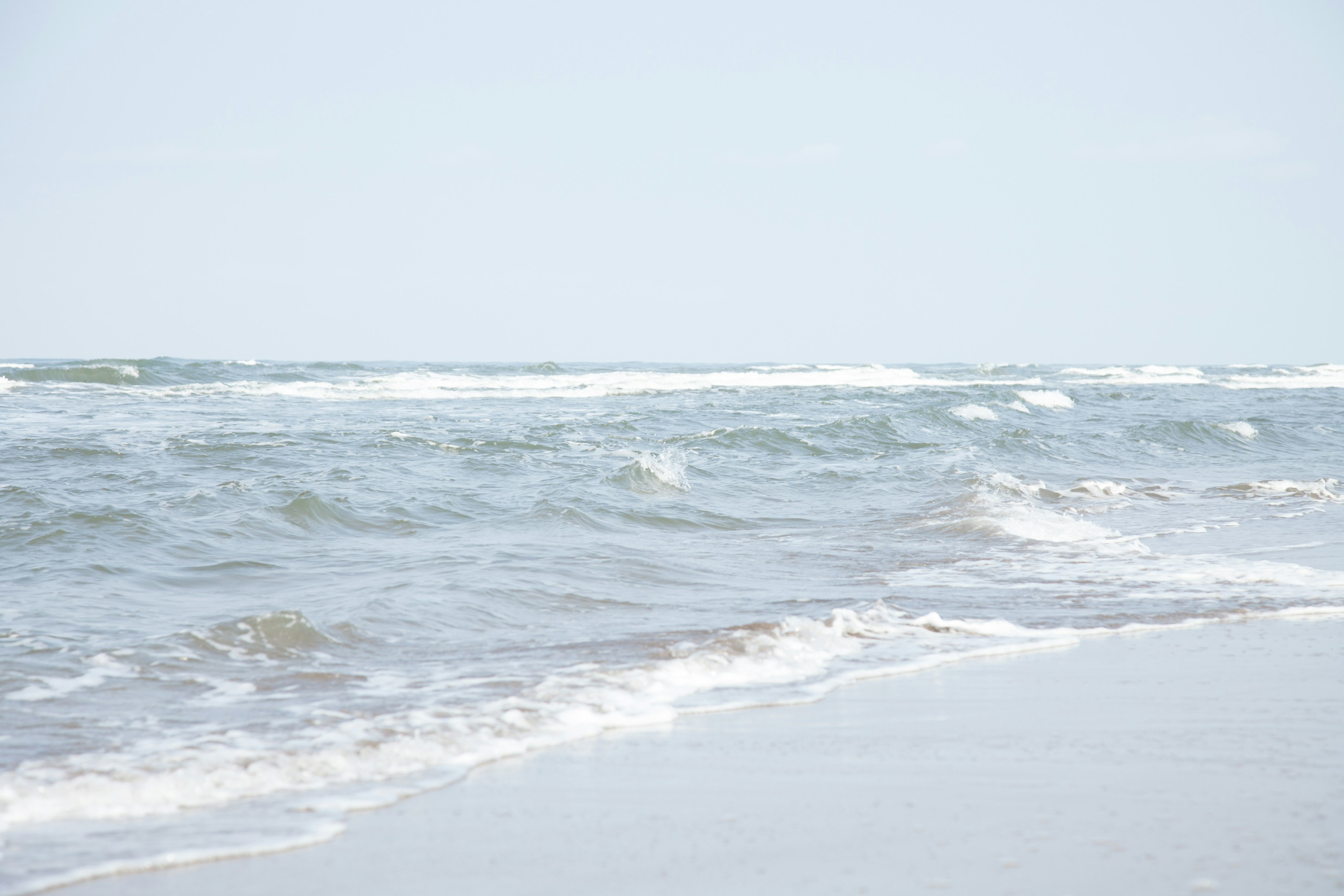 Calm seascape with gentle waves lapping at the shore