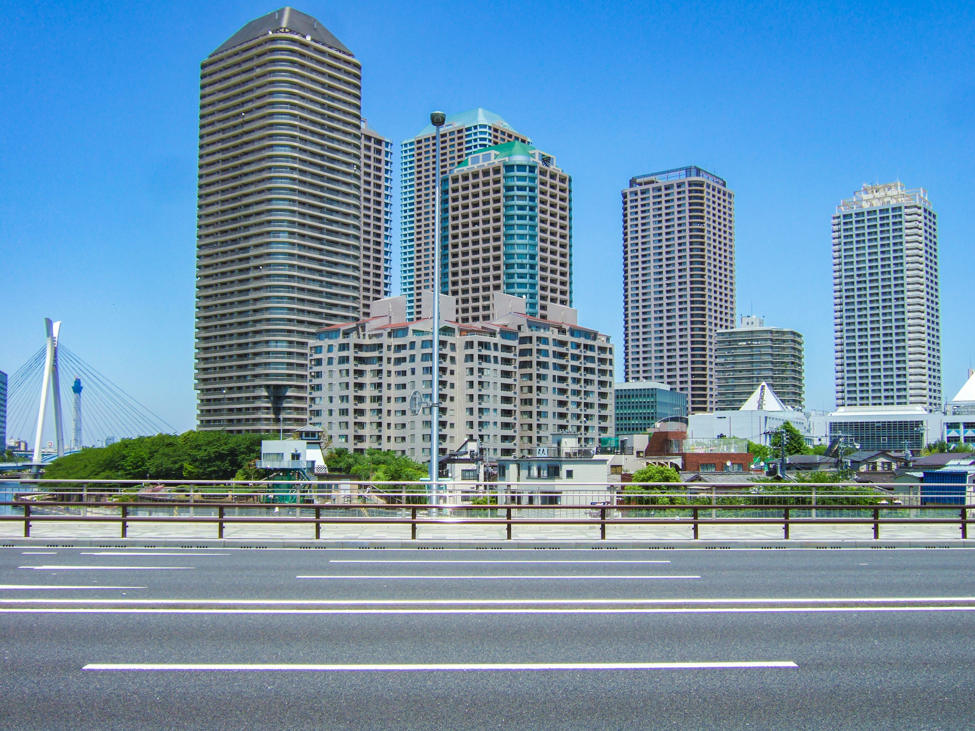 City skyline featuring tall buildings under a clear blue sky