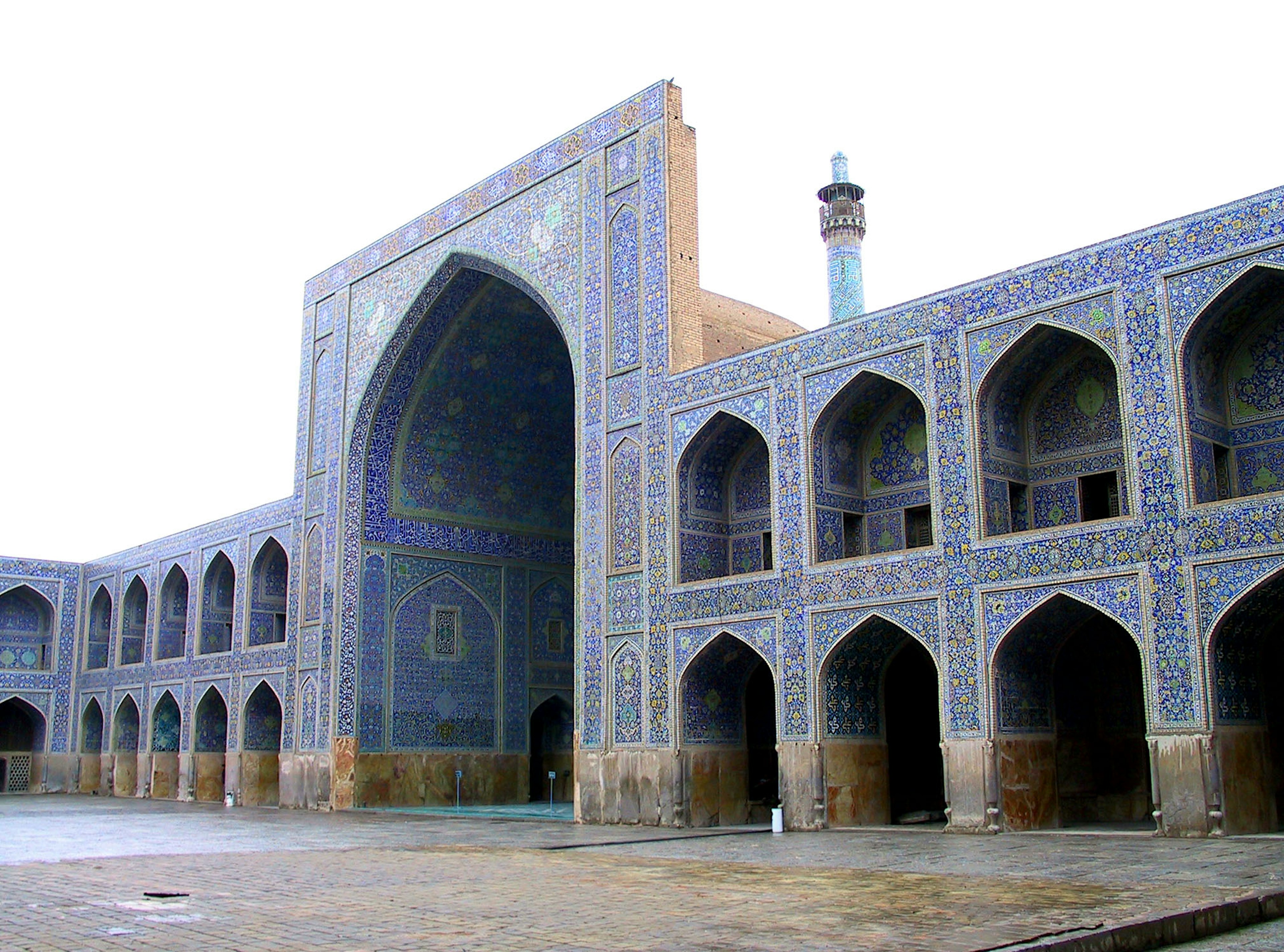 Archway entrance of a blue-tiled building with surrounding arched windows