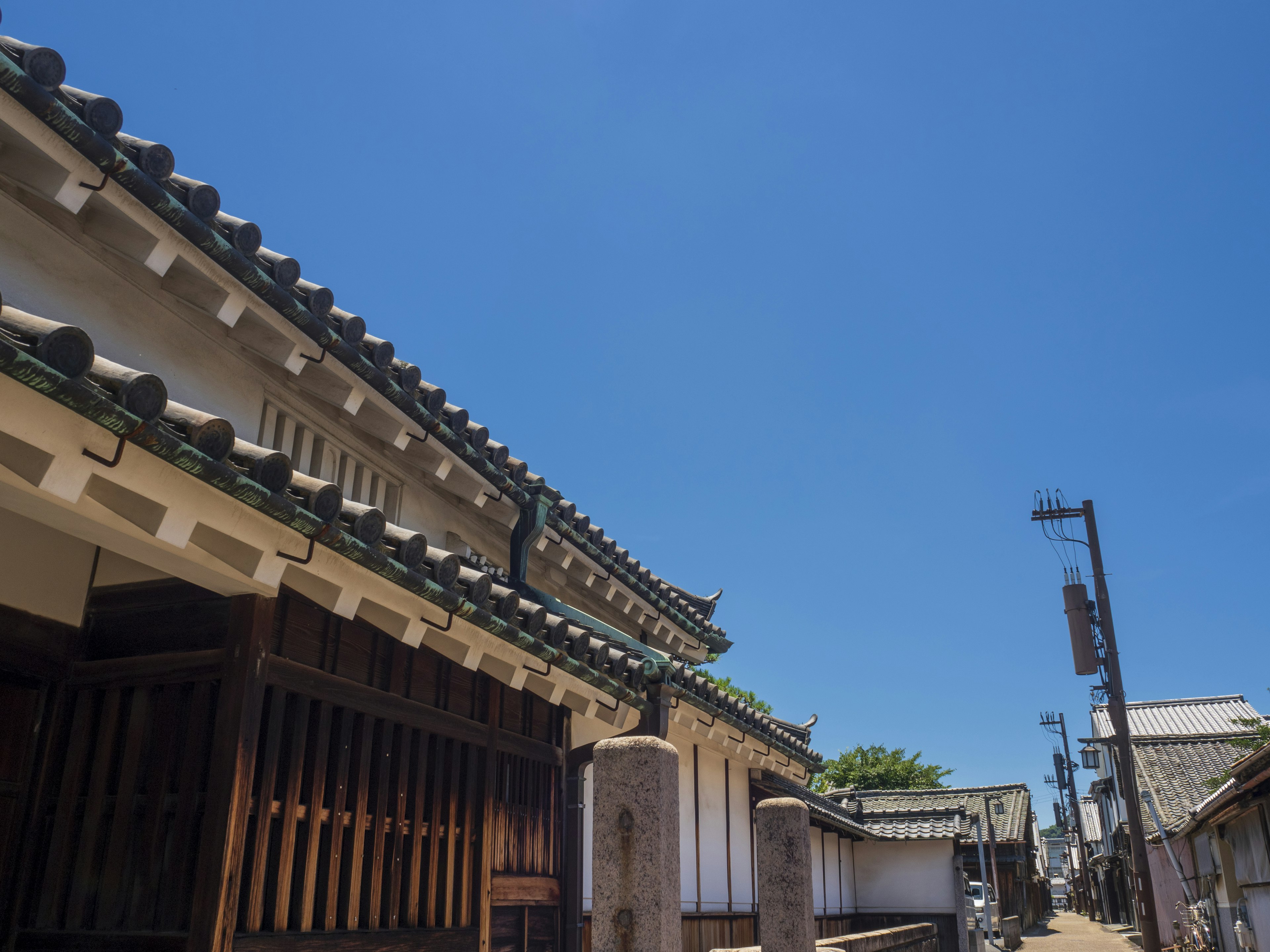 Traditional Japanese architecture under a clear blue sky